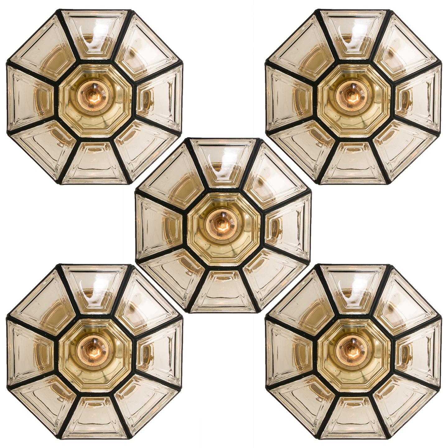 This beautiful and unique octagonal set of glass light flushmounts or wall lights were manufactured by Glashütte Limburg in Germany during the 1960s, (late 1960s or early 1970s). Nice craftsmanship. Elaborate clear bubble glass which bulges slightly