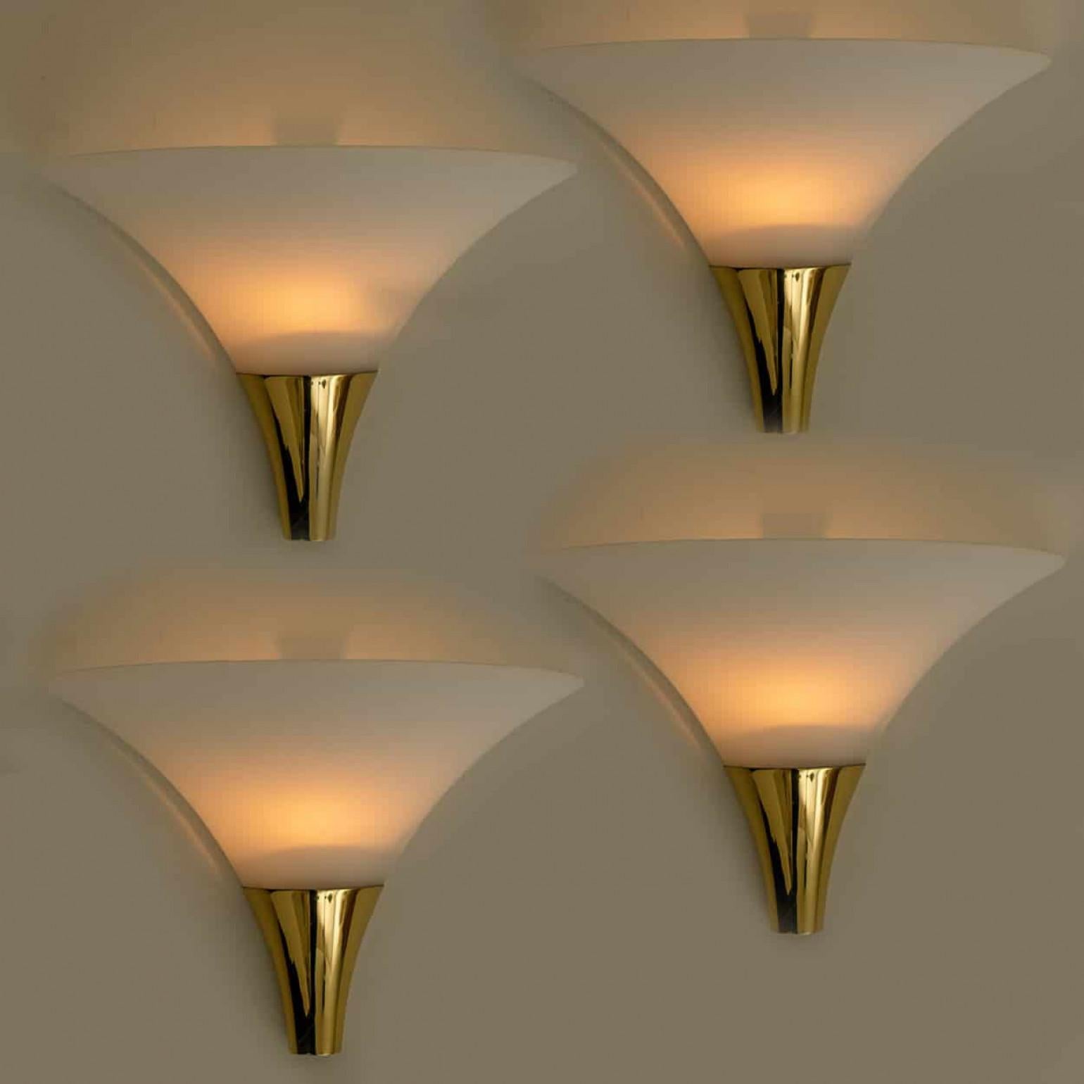 1 of the 16 Opaque Glass / Brass Wall Lights by Limburg, 1970s In Good Condition For Sale In Rijssen, NL