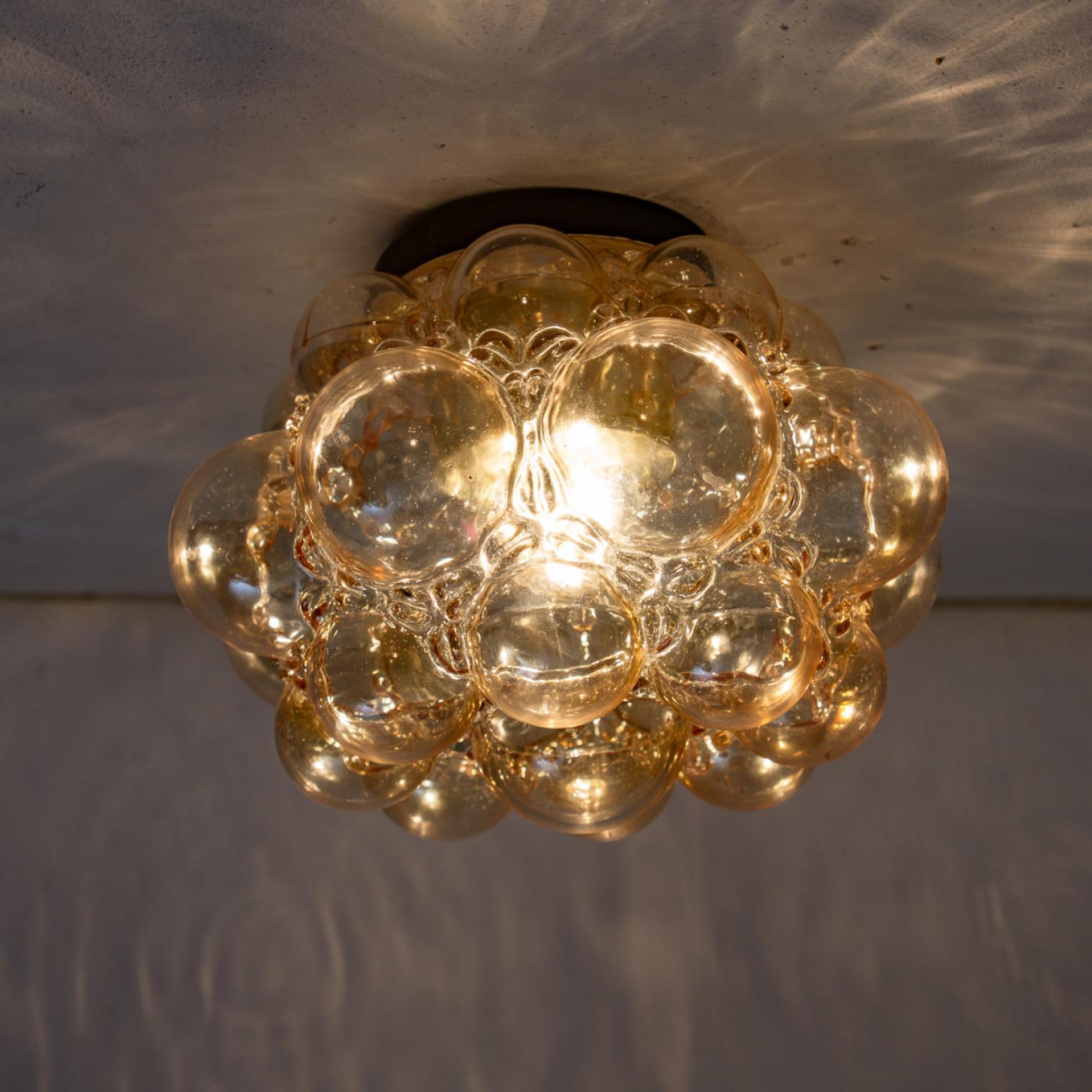1 of the 2 Amber Bubble Glass Pendant Light Fixtures by Helena Tynell, 1960 For Sale 3