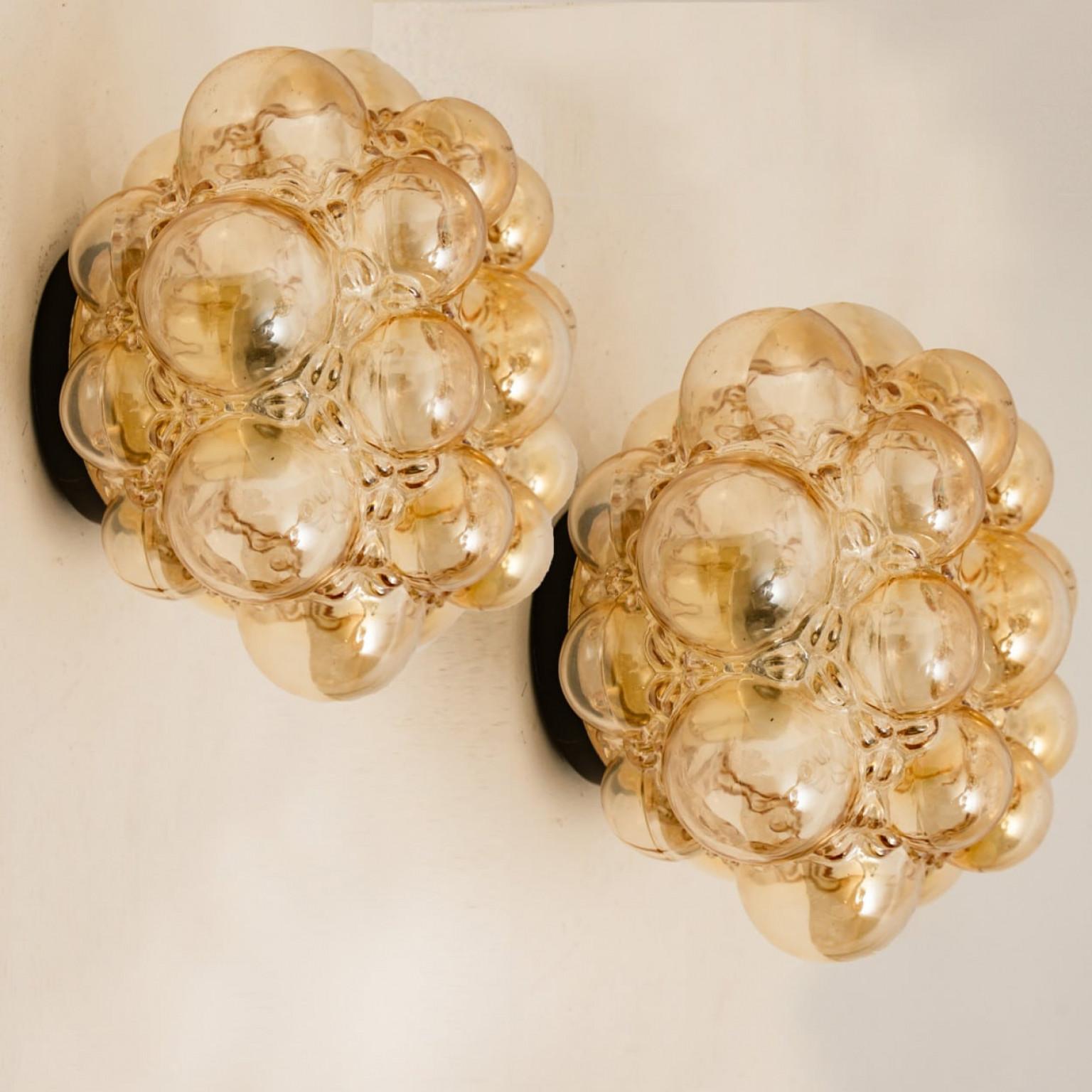 German 1 of the 2 Amber Bubble Glass Pendant Light Fixtures by Helena Tynell, 1960 For Sale