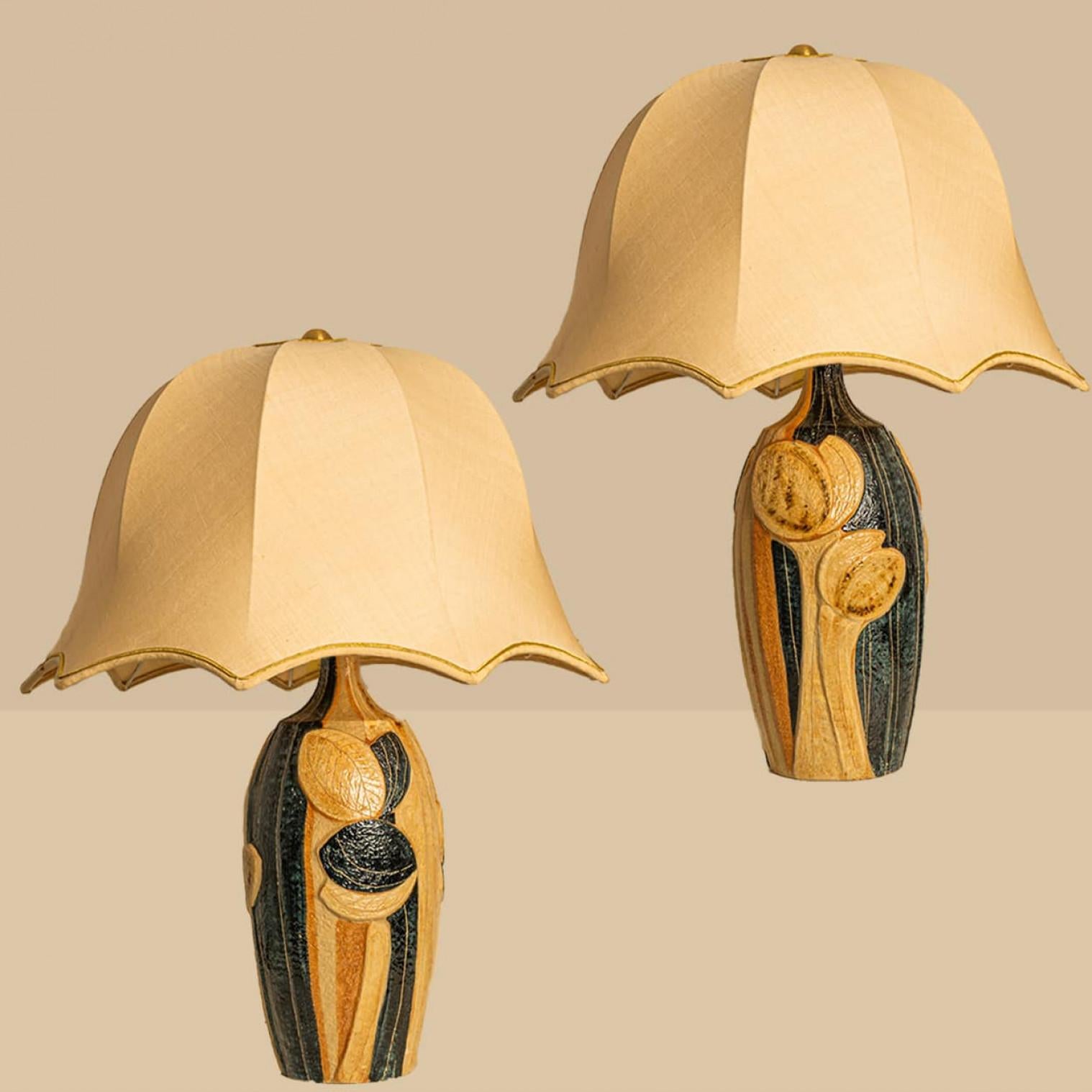 Beautiful ceramic table lamp by Noomi Backhausen for Soholm Pottery, Denmark 1960s. Combined with a custom silk lampshade made by Rene Houben.

The warm colors of the ceramic with the custom made shade complement each other very well and illuminate