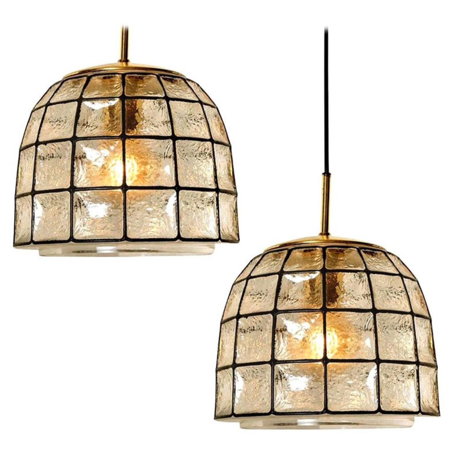 Minimal, geometric and simply shaped design. This beautiful and unique pair of hand blown glass chandeliers or pedant lights were manufactured by Glashütte Limburg in Germany during the 1960s, (late 1960s or early 1970s). Beautiful craftsmanship.
