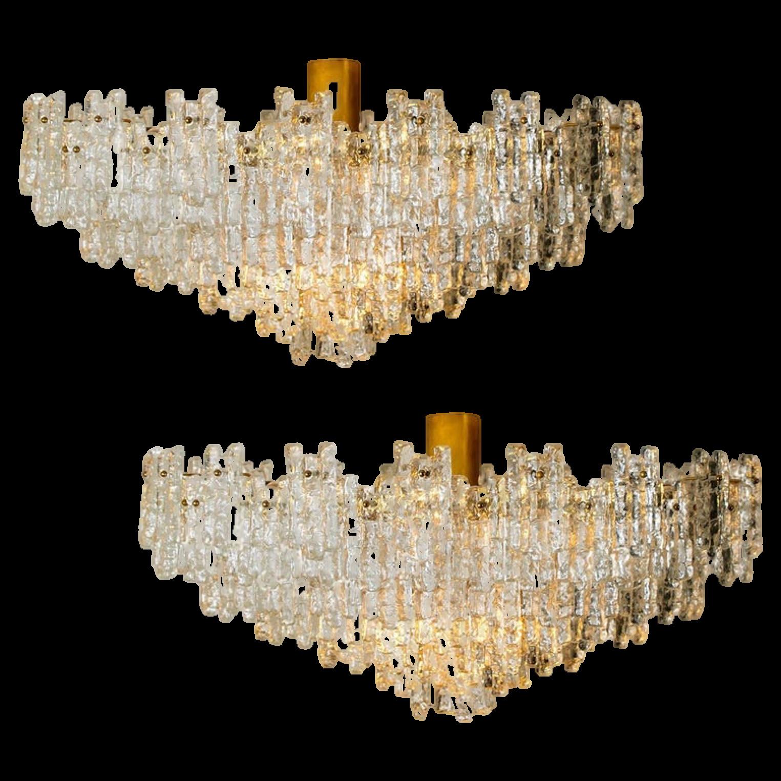 1 of the 2 exceptional, huge, clean and modern six-tier ballroom flush mount chandeliers by J.T. Kalmar Leuchten from the 1960s. The chandelier consists six layers with a 141 hand blown textured glass shades mounted on a brass frame arranged in