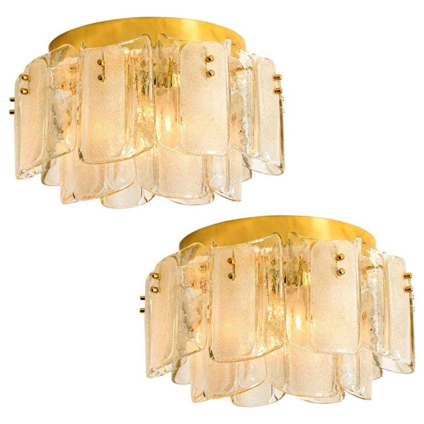 1 of the 2 unique large and elegant glass flush mounts in the style of J.T. Kalmar, manufactured in the 20th century, circa 1970 (late 1960s or early 1970s). Wonderful high-end light fixtures with brass detail and 16 thick textured blown glass