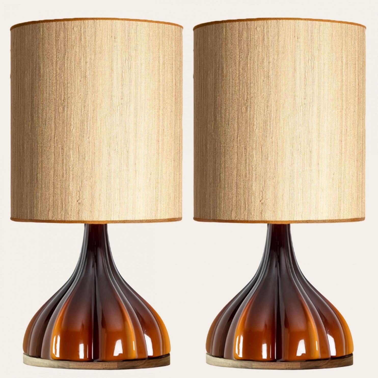 A beautiful and unique brown flower table lamp, made in the 1970s by  german designer and company Peill Putzler. The shade is custom made by Rene Houben.

The lampbase is made of a ‘cast opaque brown glass’ with an inner white glaze, in the shape of