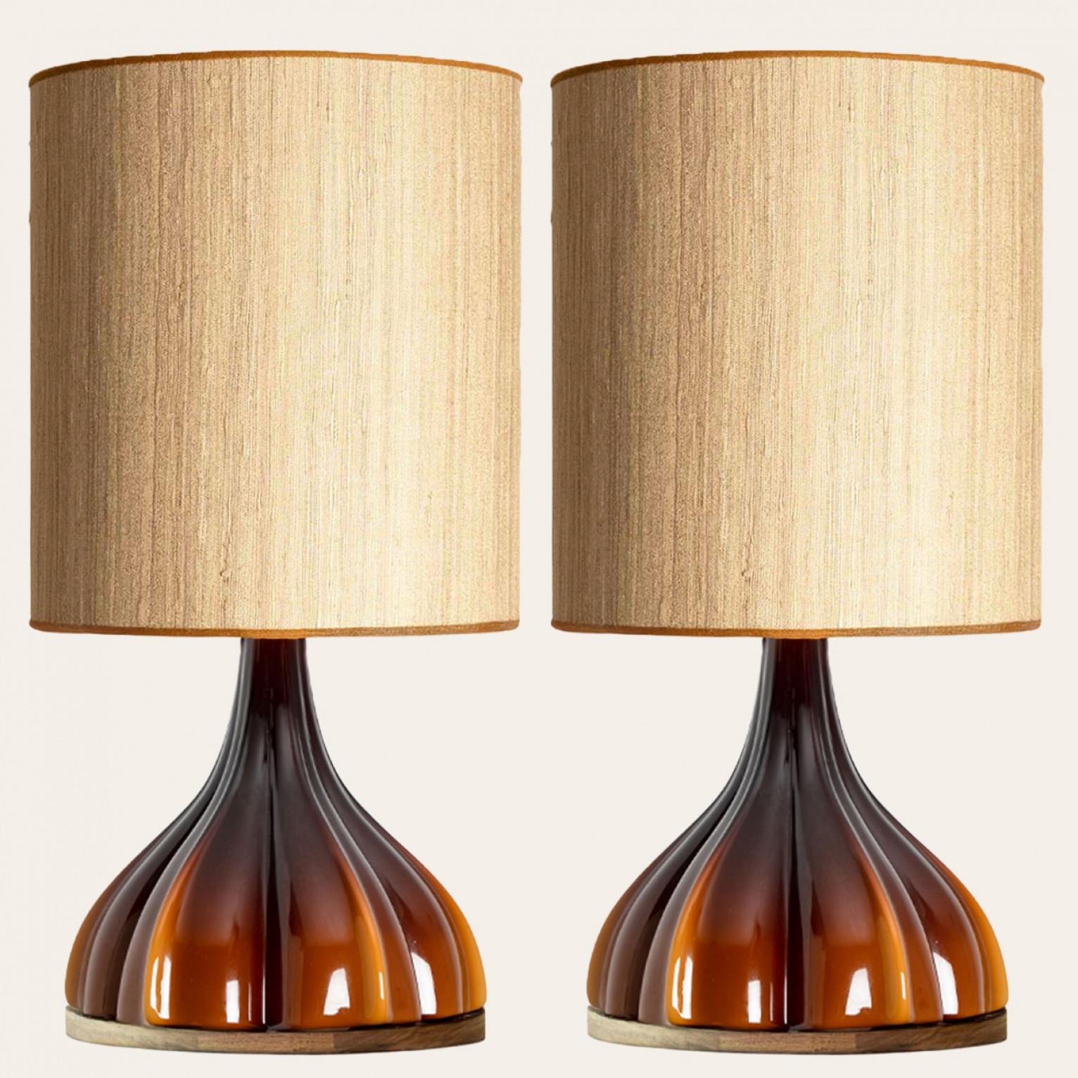 A beautiful and unique brown flower table lamp, made in the 1970s by  german designer and company Peill Putzler. The shade is custom made by Rene Houben.

The lampbase is made of a ‘cast opaque brown glass’ with an inner white glaze, in the shape of
