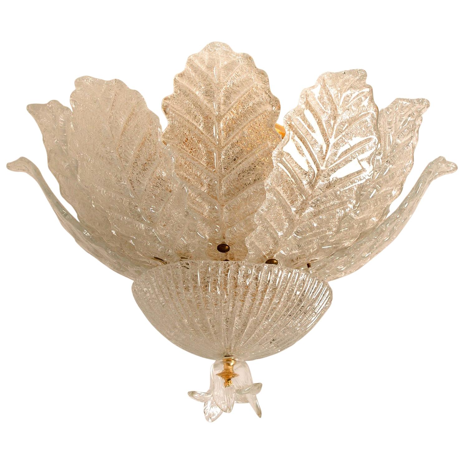 An elegant hand blown Murano glass flushmount of Barovier & Toso. The light fixture consists 12 blown Murano glass leaves. Mounted on a brass frame. The leaves refract light beautifully. The flush mount fills the room with a soft, warm and welcoming
