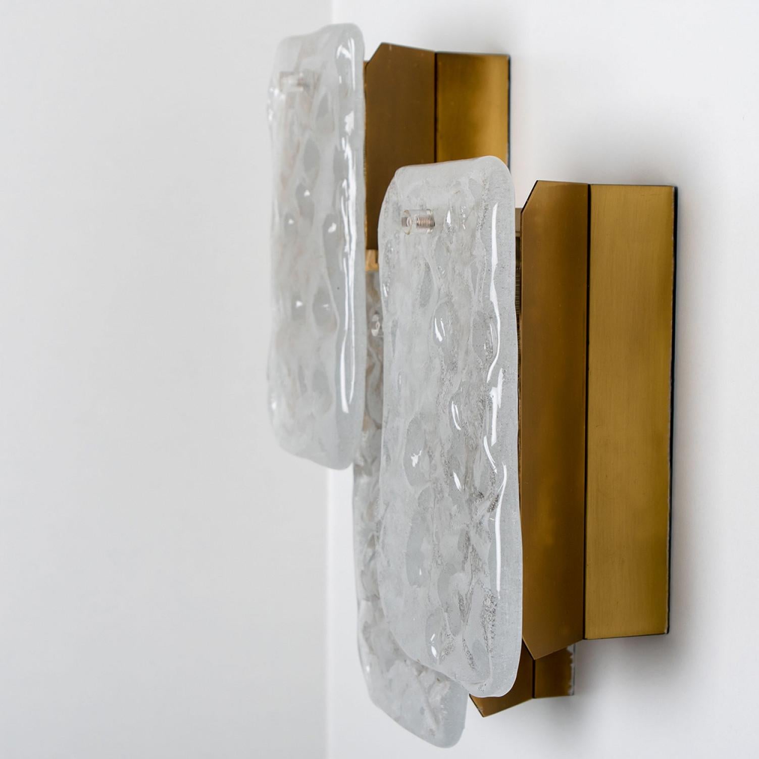 A stunning light fixture designed by J.T Kalmar, manufactured by Kalmar Franken, Austria in the 1960s.
High-end handmade design from the 20th century. The three large rectangles of white, opaque textured glass provide a nicely diffuse