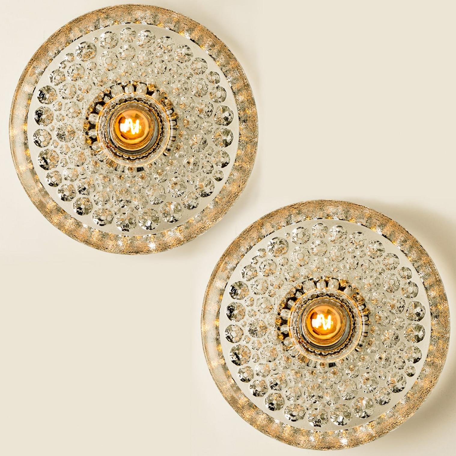 Mid-20th century glass flush mounts, made around 1970 in Germany, Europe. Featuring a bubble glass shade with a light bulb in the middle. The light illuminates wonderful.

Can used as flush or wall lights.

Please note the price is for one piece.