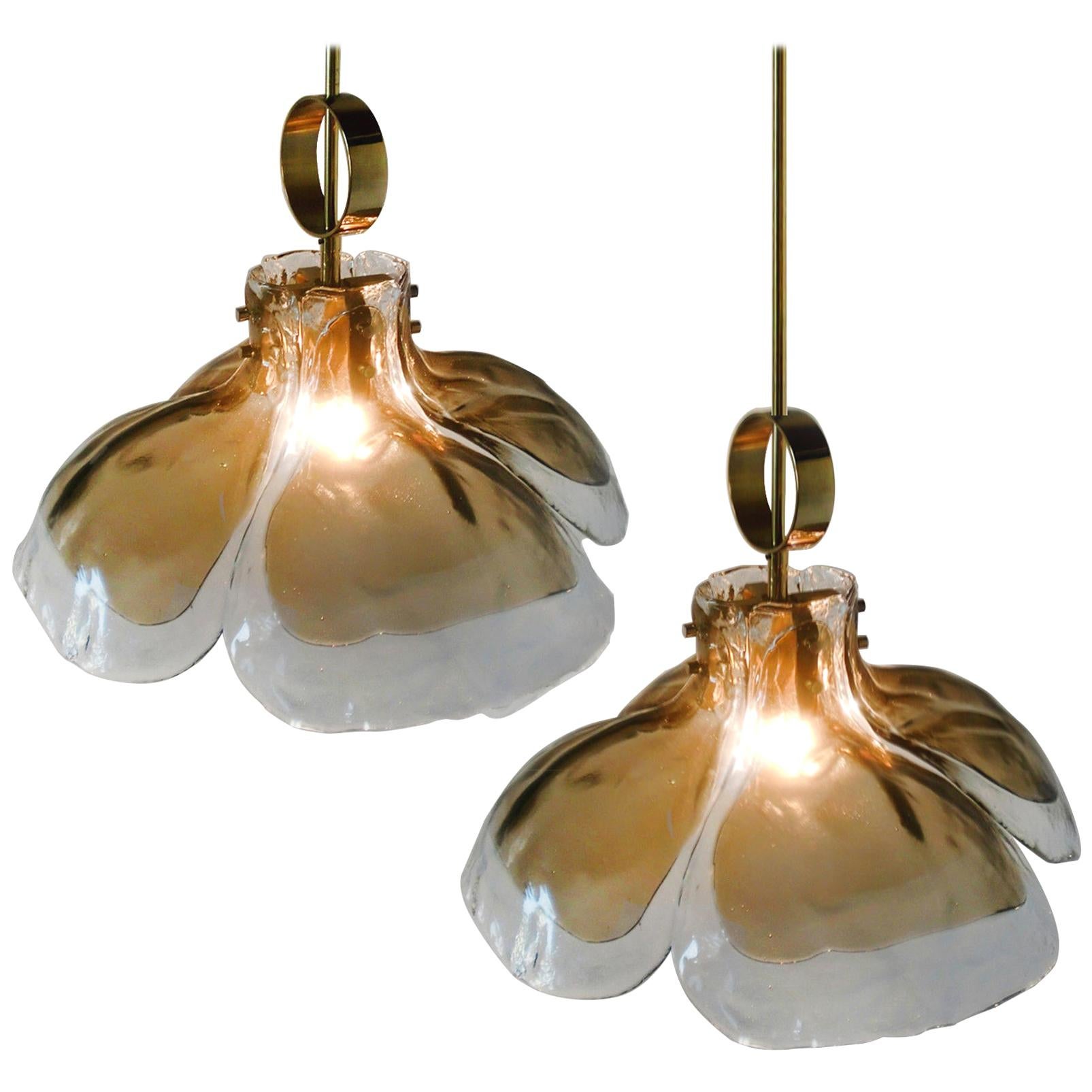 One of two beautiful midcentury brass chandeliers with four melting glass panels in the shape of a flower (diameter 20.7 inch / 51 cm). Illuminates beautifully.

Designed and executed by Kalmar Vienna in the 1970s. Hand blown melting glass, made
