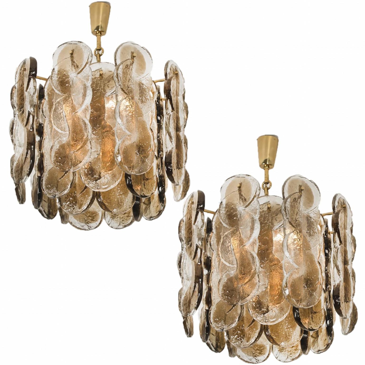high quality murano glass chandelier by Kalmar, 1960s smoked swirl ice glass, clear twisted crystal glass panels with a light gold dish amber colored stripe in it.

Kalmar was the most important producer of premium-quality chandeliers in Austria
