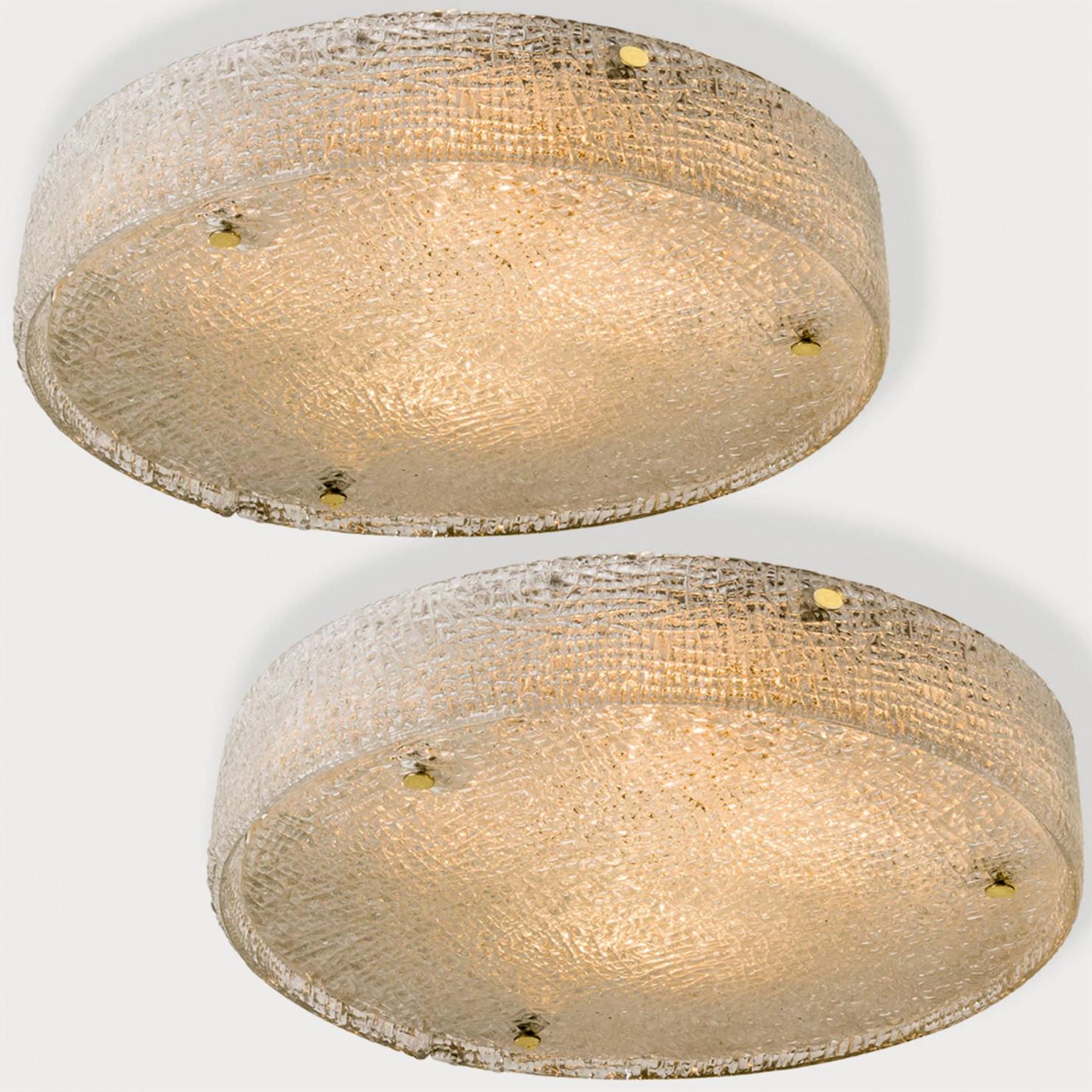 1 of the 2 Mid-Century Modern textured ice glass light fixtures by manufacturer Kaiser, circa 1965.  Clean simple but high-end design. Illuminates beautifully. Each light fixture, often mistakenly attributed to Kalmar, features a huge handmade thick