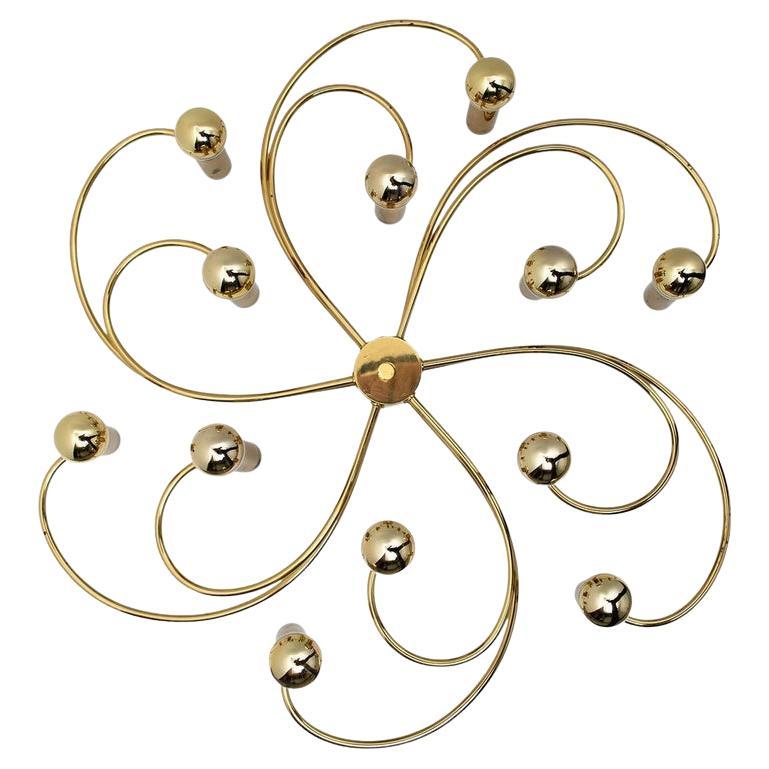 Two Gorgeous Sciolari style ceiling or wall flush mounts by Leola. Made with solid polished brass, Germany, 1970s.

Can be used as ceiling flush mount or as an extraordinary wall light.

The light fixture requires 13 E14 candelabra bulbs, each up to