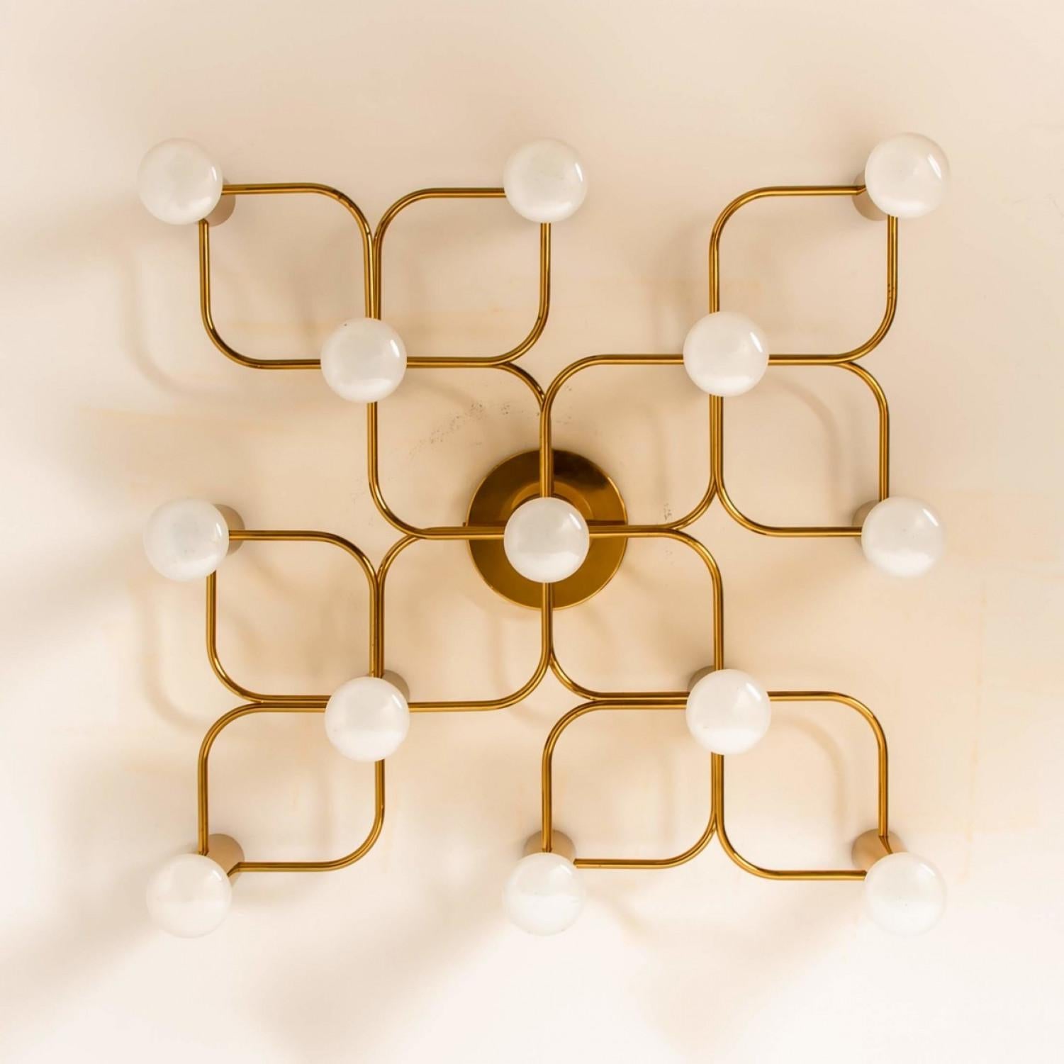Gorgeous Sciolari style ceiling or wall flush mount by Leola. Made with solid brass, Germany, 1960s.

Can be used as ceiling flush mount or as expressive wall light.

The light fixture requires 13 X E 14 candelabra bulbs, each up to 40 watts.