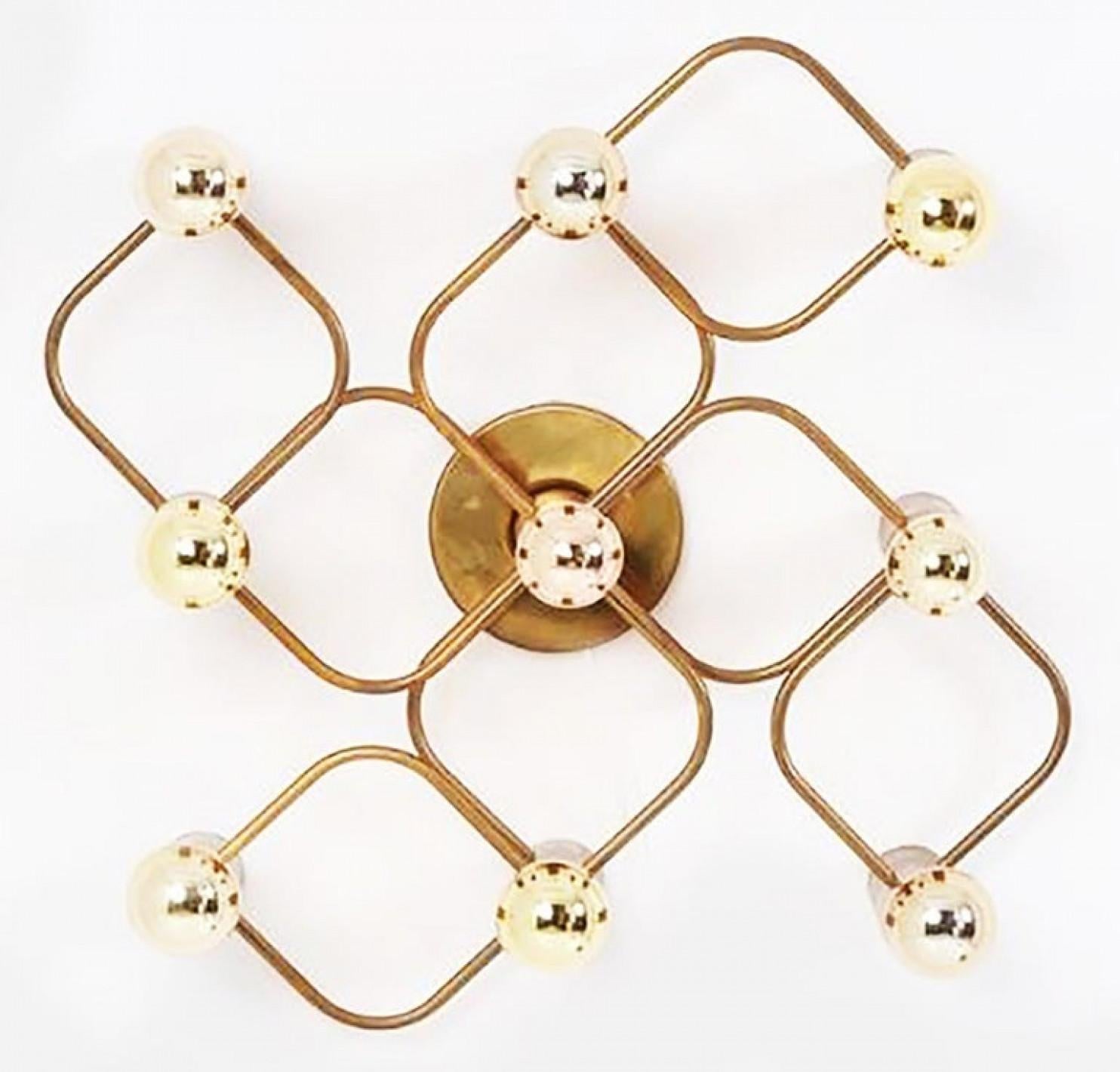 Gorgeous Sciolari style ceiling or wall flush mount by Leola. Made with solid polished brass, Germany, 1970s.

Can be used as ceiling flush mount or as an extra ordinary wall light. 2 pieces available

The light fixture requires 9 E14 candelabra