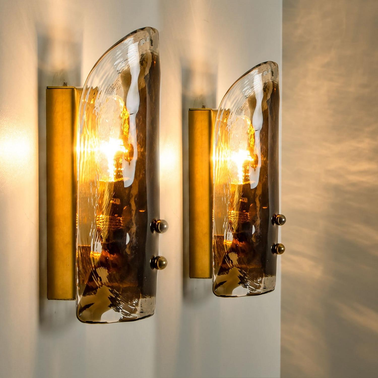 High-end wall sconces made of blown clear and opal Murano glass on a brass hardware. Designed and produced by J.T. Kalmar, Austria in the 1960s. Minimalistic design executed with a taste for excellence in craftsmanship. These are real statement