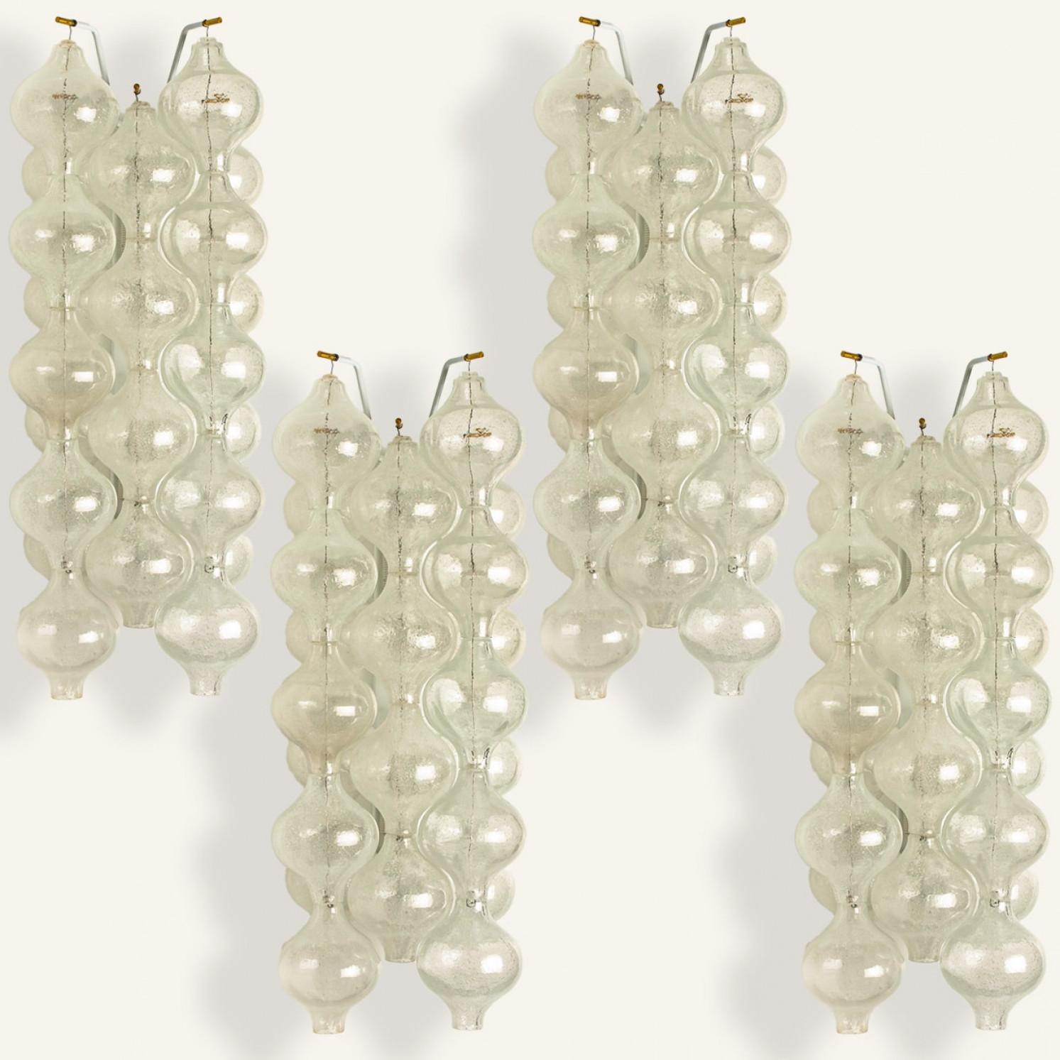1 of the 2 pairs unique large and elegant 'Tulipan' glass wall sconces by J.T. Kalmar, Austria, Vienna, manufactured in midcentury, circa 1970 (late 1960s or-early 1970s). Tulip shaped hand blown bubble glasses. With a white enameled metal frame