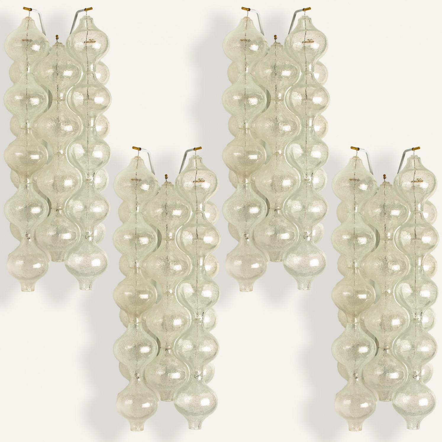 1 of the 2 pairs unique large and elegant 'Tulipan' glass wall sconces by J.T. Kalmar, Austria, Vienna, manufactured in midcentury, circa 1970 (late 1960s or-early 1970s). Tulip shaped hand blown bubble glasses. With a white enameled metal frame