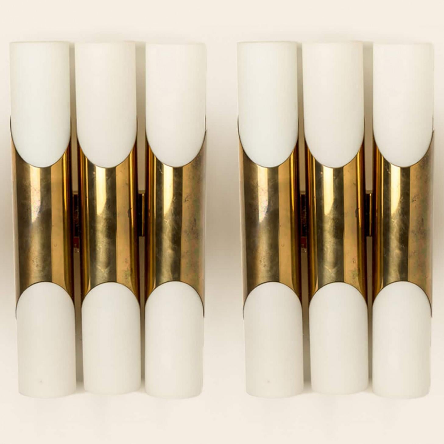 Stunning wall sconces designed in the style of RAAK. Opaline glass with brass details.
Minimalistic design executed with a taste for excellence in craftsmanship.

Good condition that means this piece is not new but in a very good vintage condition