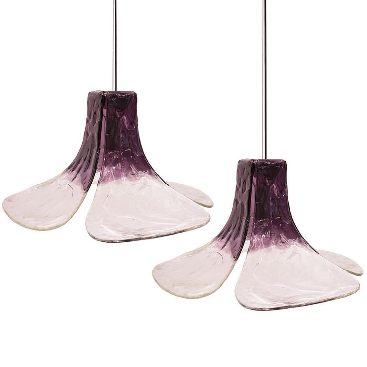 1 of the 2 beautiful mid century Carlo Nason for Kalmar, Austria. Floral pendants in clear and purple tinted mazzega murano glass.
Four individual glass murano leaves mounted on a metal frame.

We can deliver divered colors of cord, an steel cable