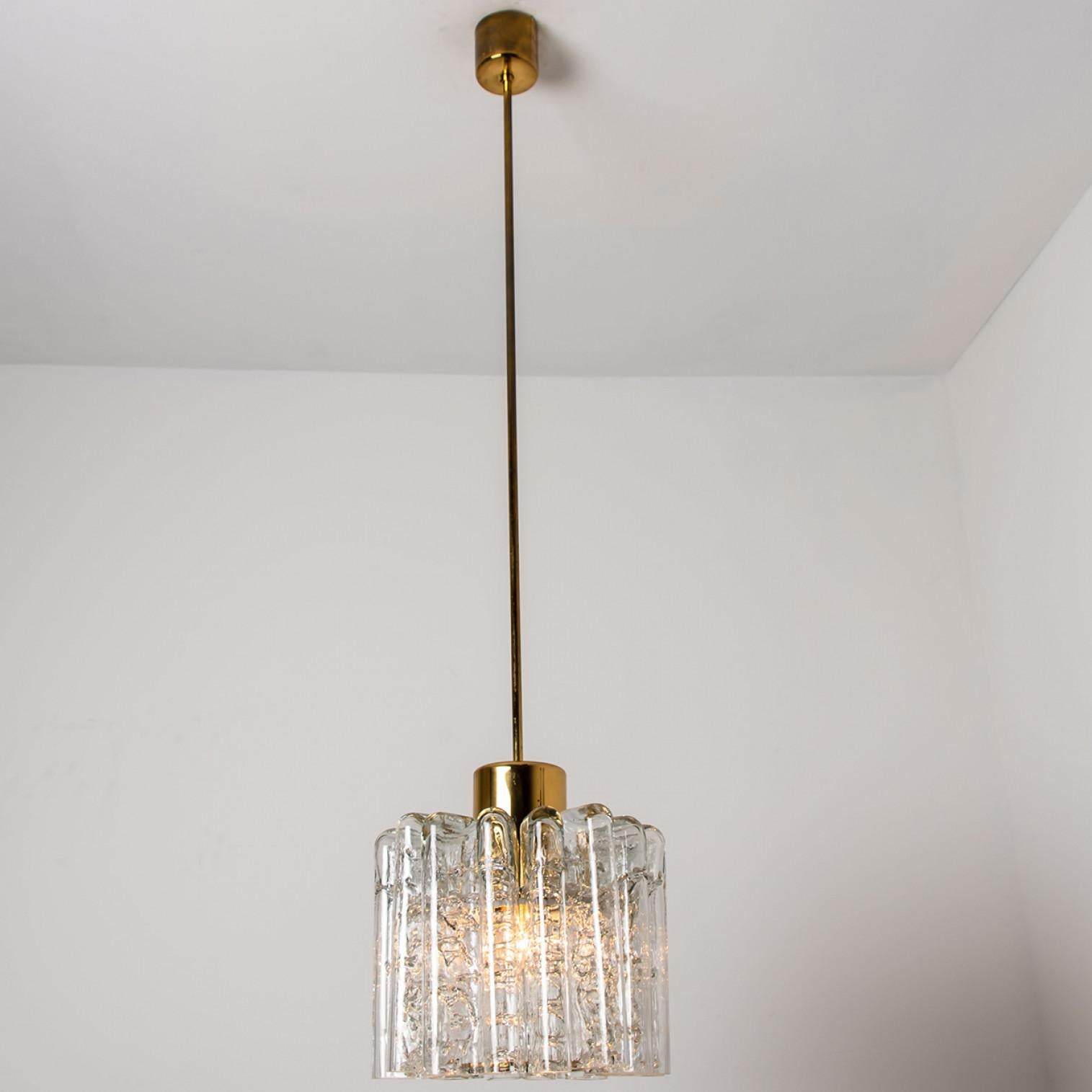 Brass 1 of the 2 Round Textured Clear Glass Doria Pendant Lamp, 1960s For Sale