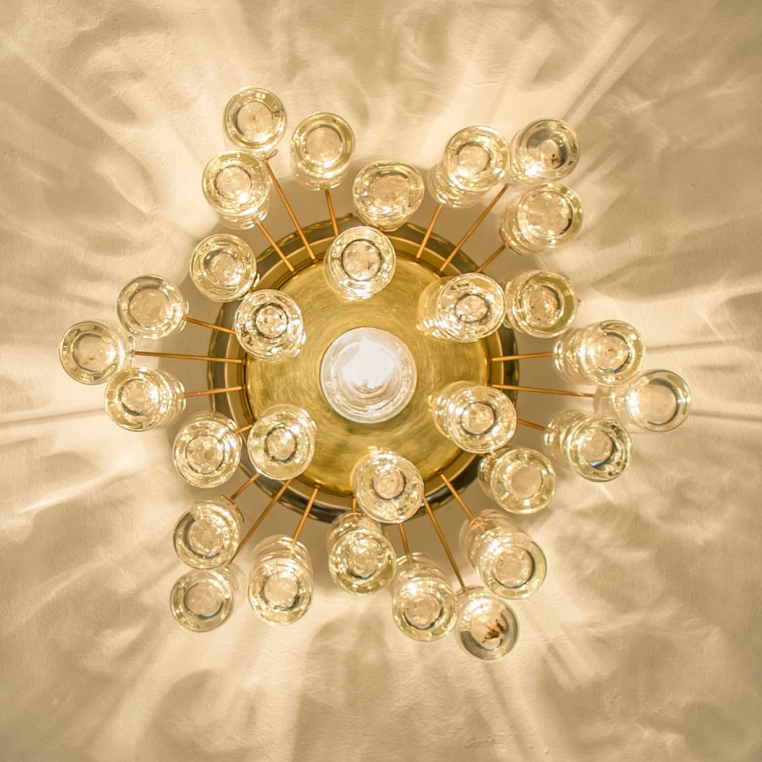 1 of the 2 Round Textured Clear Glass Gold Flush Mount, 1960s, Doria Leuchten In Good Condition For Sale In Rijssen, NL