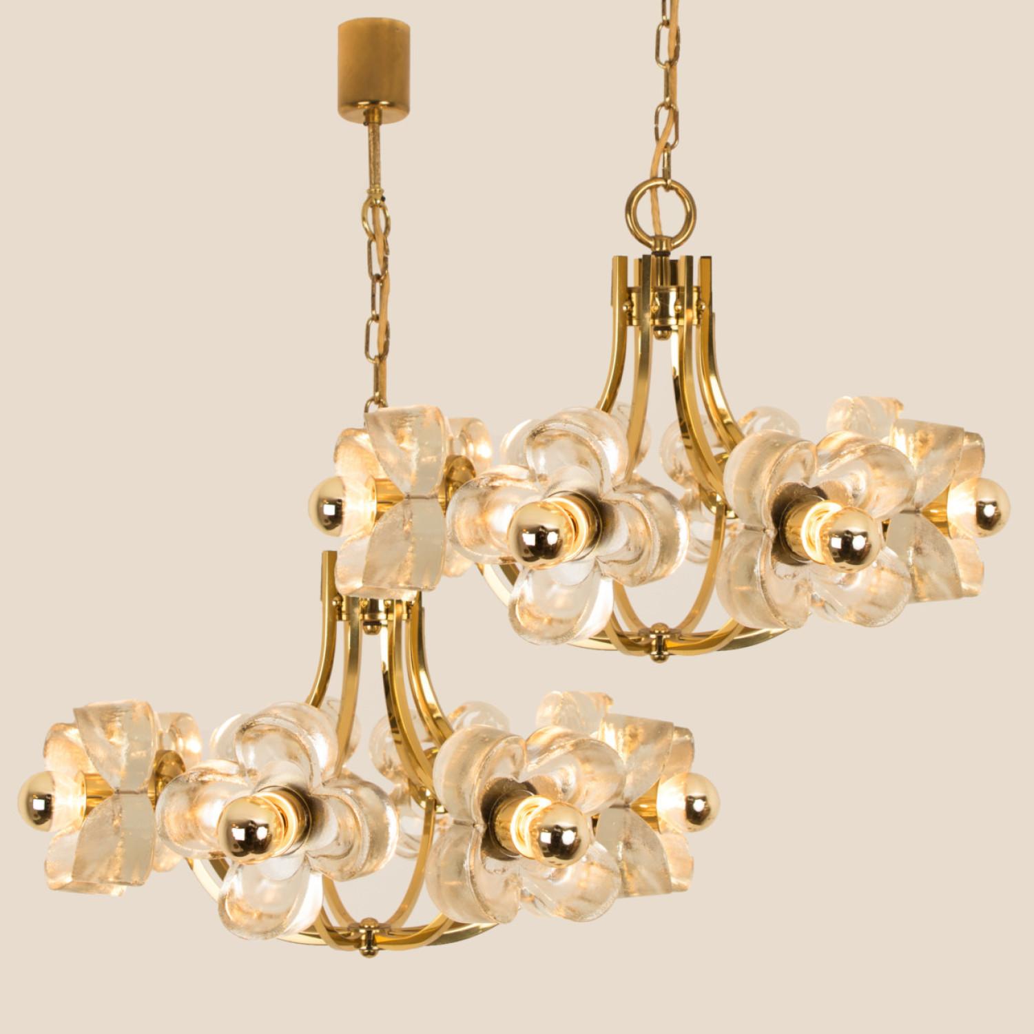 This ceiling light was designed by Simon and Schelle, featuring a rectangular brass base and eight massive glasses in the shape of a four lobed flower.

Dimensions:
Height 15.75 (40cm) total 51.18 (130 cm)
Diameter 23.62 (60 cm)

Please notice the