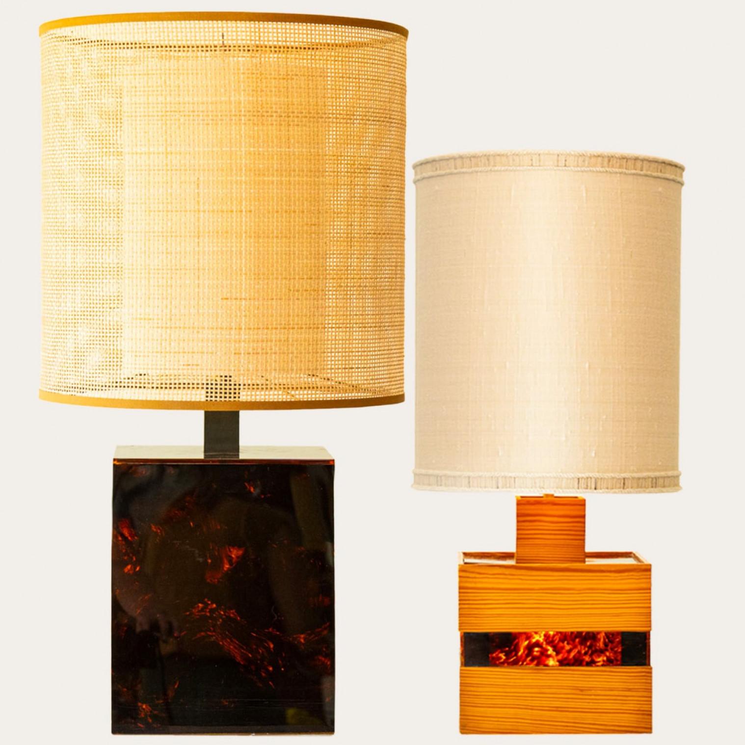 1 of the 2 heavy quality wooden and glass table lamps.

These lamp bases bring refined elegance and rich visual appeal to any interior. With its beautiful shapes and materials, it offers a unique presence.

The square bases with natural wood and