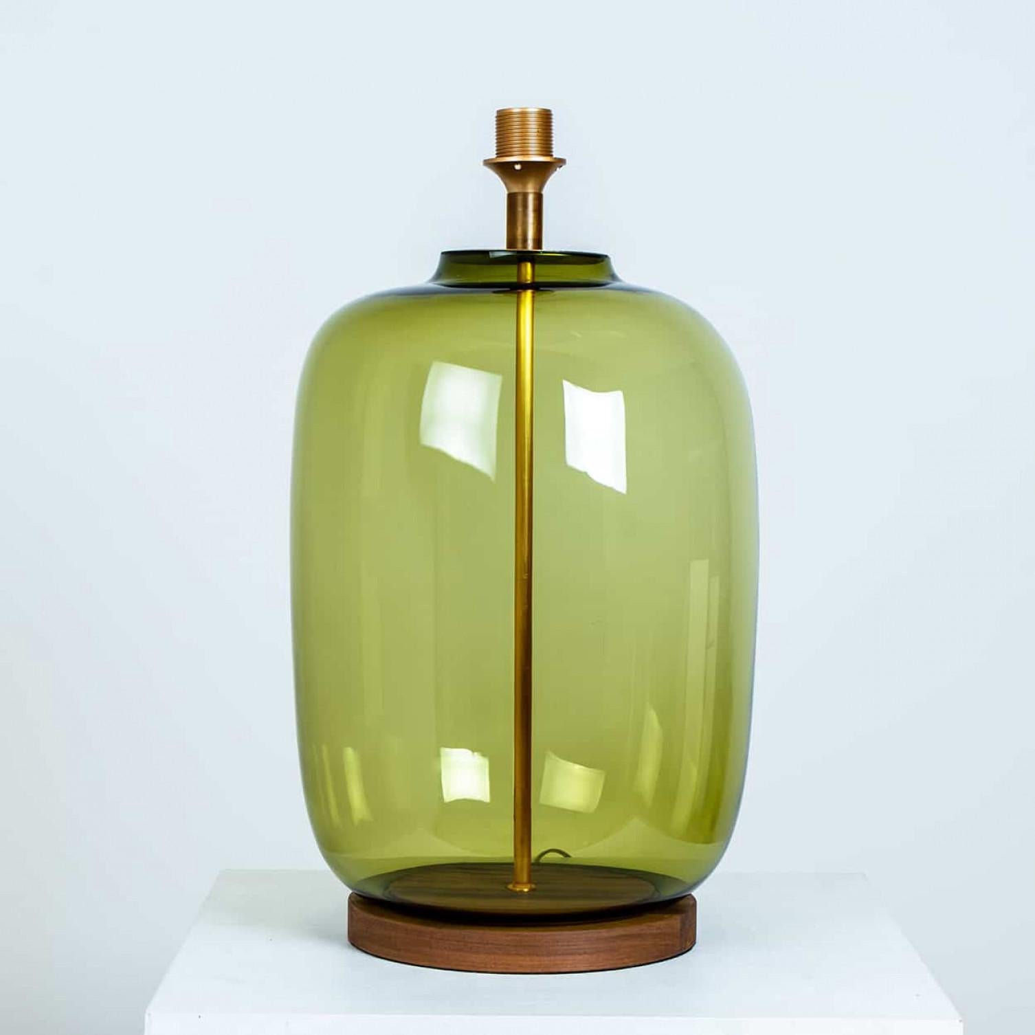 High quality amber glass bubble table lamp, 1970s.

This unique table lamp features a striking vintage amber glass base with an elegant, sculptural bubble silhouette. The warm amber hue adds a retro touch while casting a soft, inviting glow. Topped