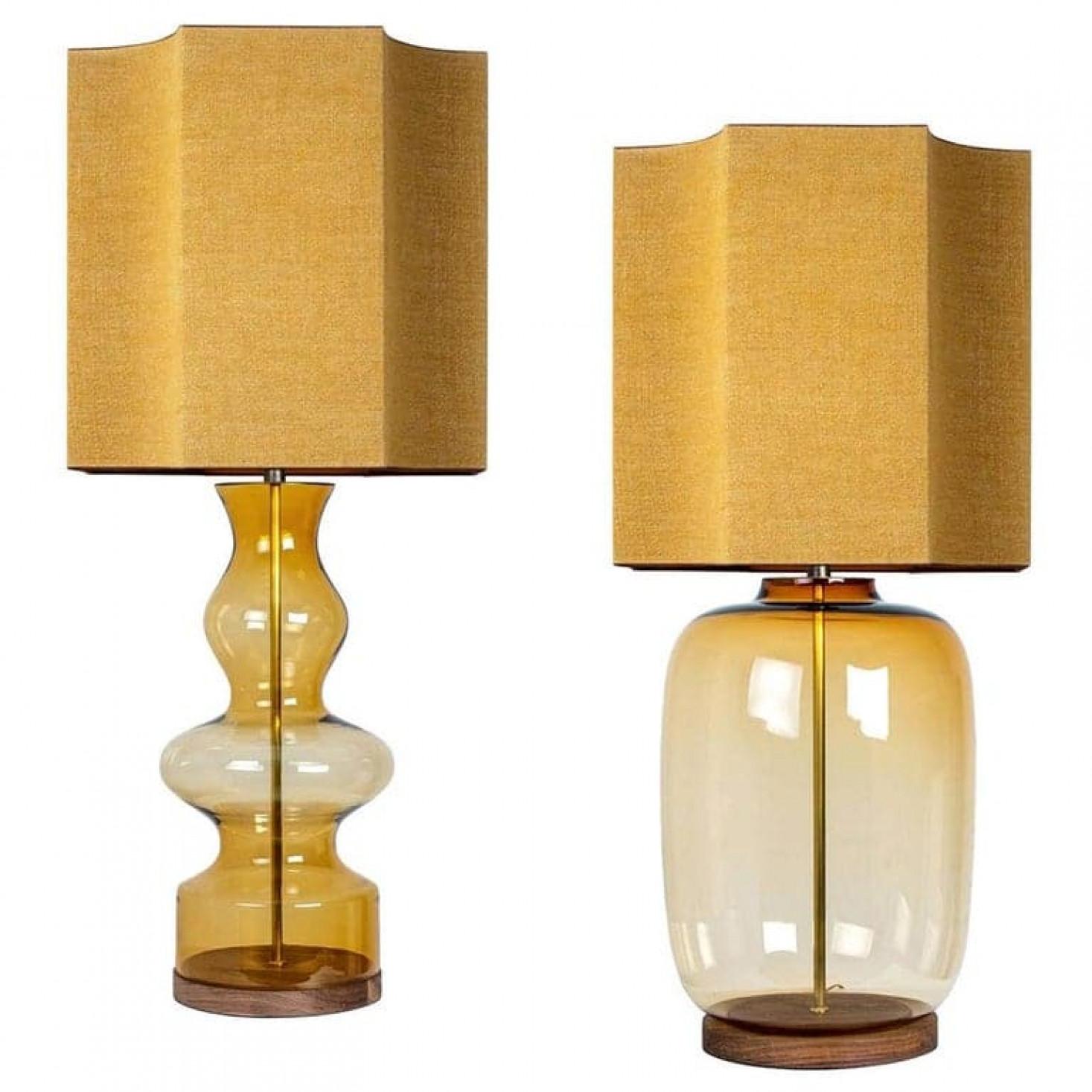 A unique Minimalist timeless design. Each extra large glass table lamp features a green exceptional transparent shaped base with a solid walnut wooden foot with old brass accents and a brass rod running through the center. Enhancing the light and