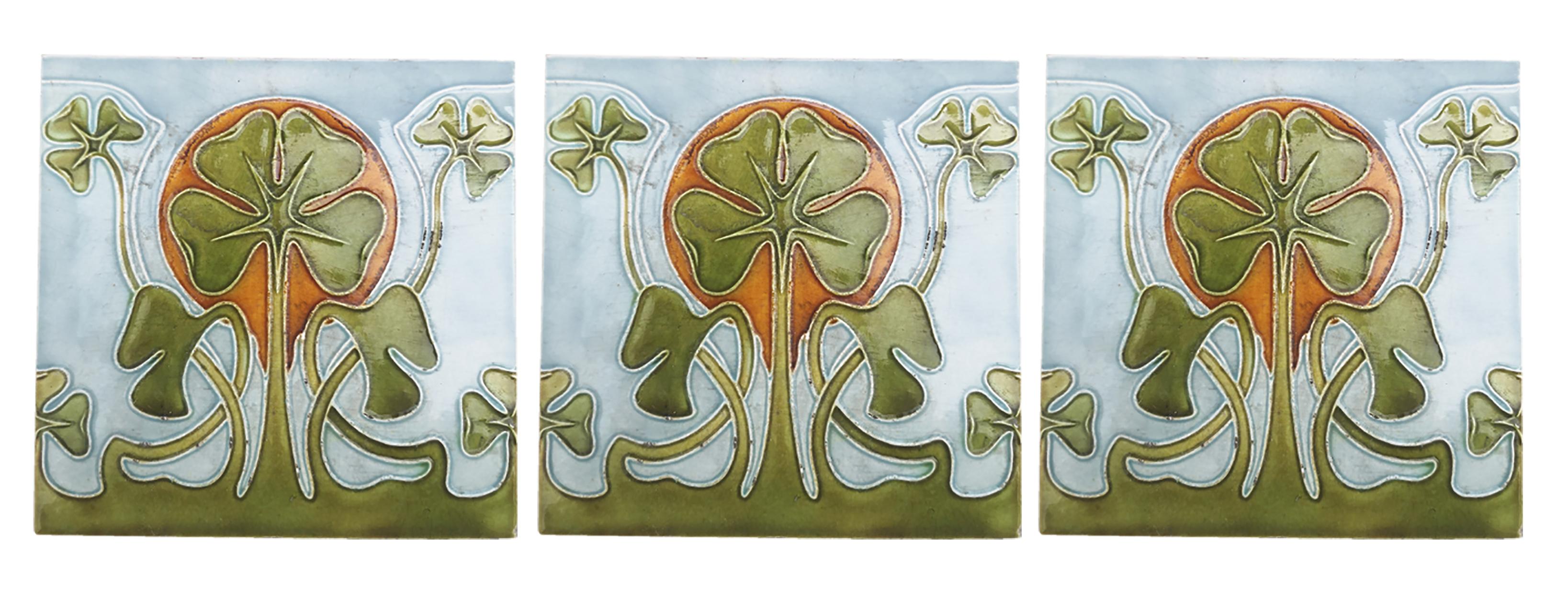 This is an amazing set of antique Art Nouveau handmade tiles 1920s. 
A beautiful relief and deep green, and brown color and light blue and white back ground. These tiles would be charming displayed on easels, framed or incorporated into a custom