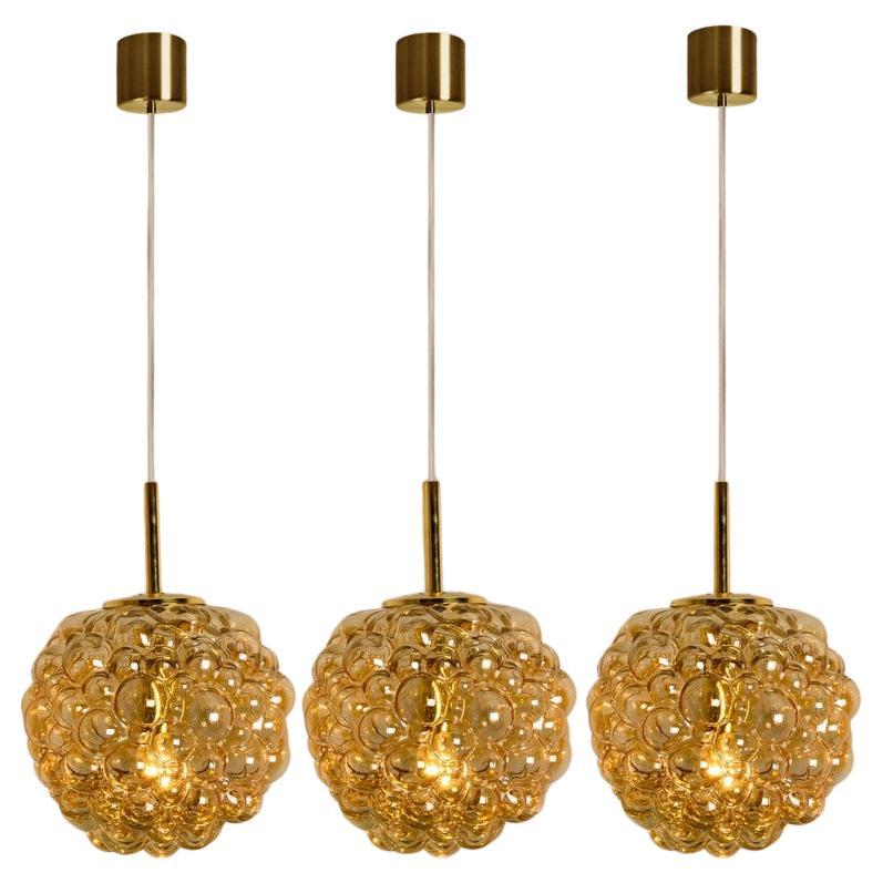 1 of the 3 Bubbled Glass and Brass Pendants by Helena Tynell, Germany 1970