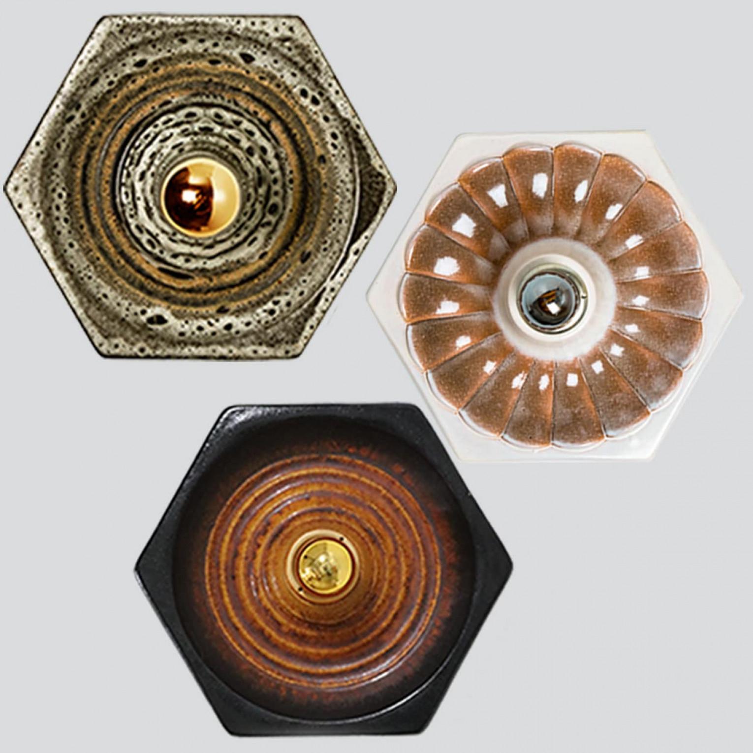 Ceramic wall lights in Fat Lava style. Manufactured by Pan Leuchten, Germany in the 1960s.

The style of the glaze is called 'Fat Lava'. Which means the glaze is thick on some parts, like lava.
A typical way to finish ceramic in mid-century