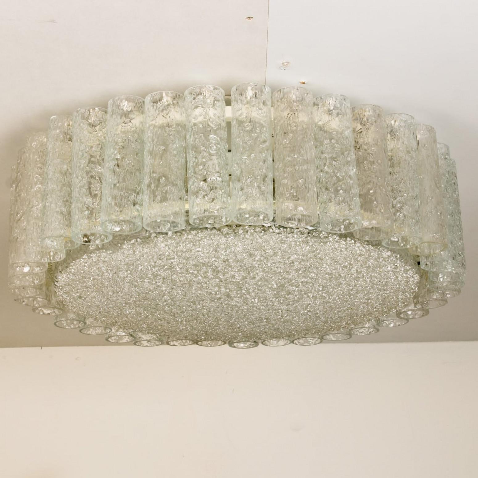 1 of the 2 Doria flush mount chandeliers, organic glass tubes surrounding a central glass diffuser mounted with minimal exposed hardware for a clean and elegant look. The stylish elegance of this lamp suits many environment, from midcentury to