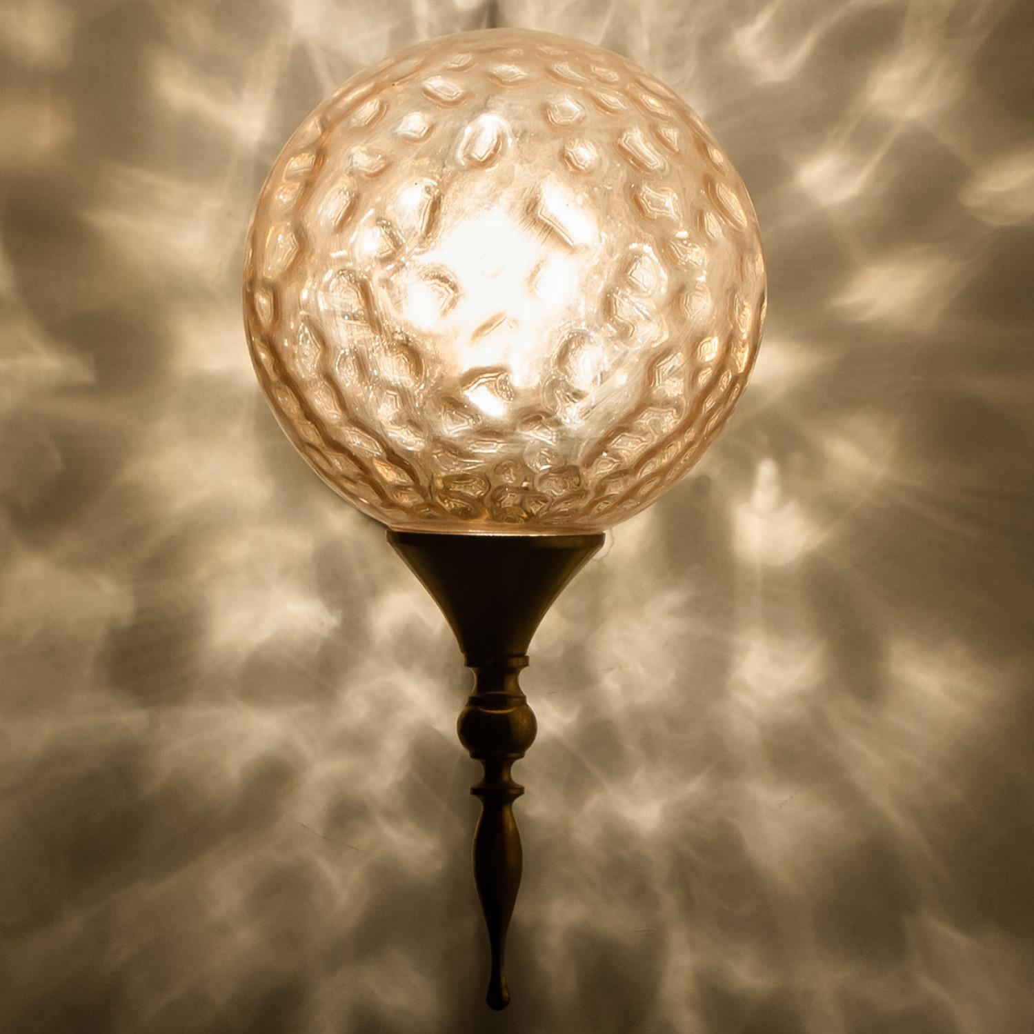 These stunning wall lights with each one glass sphere and gold-plated fittings was produced in the 1970s in the style of Brotto. Illuminates beautifully. Elegant and fine, it is comfortable with all decor periods.

Dimensions:
Height: 10.62