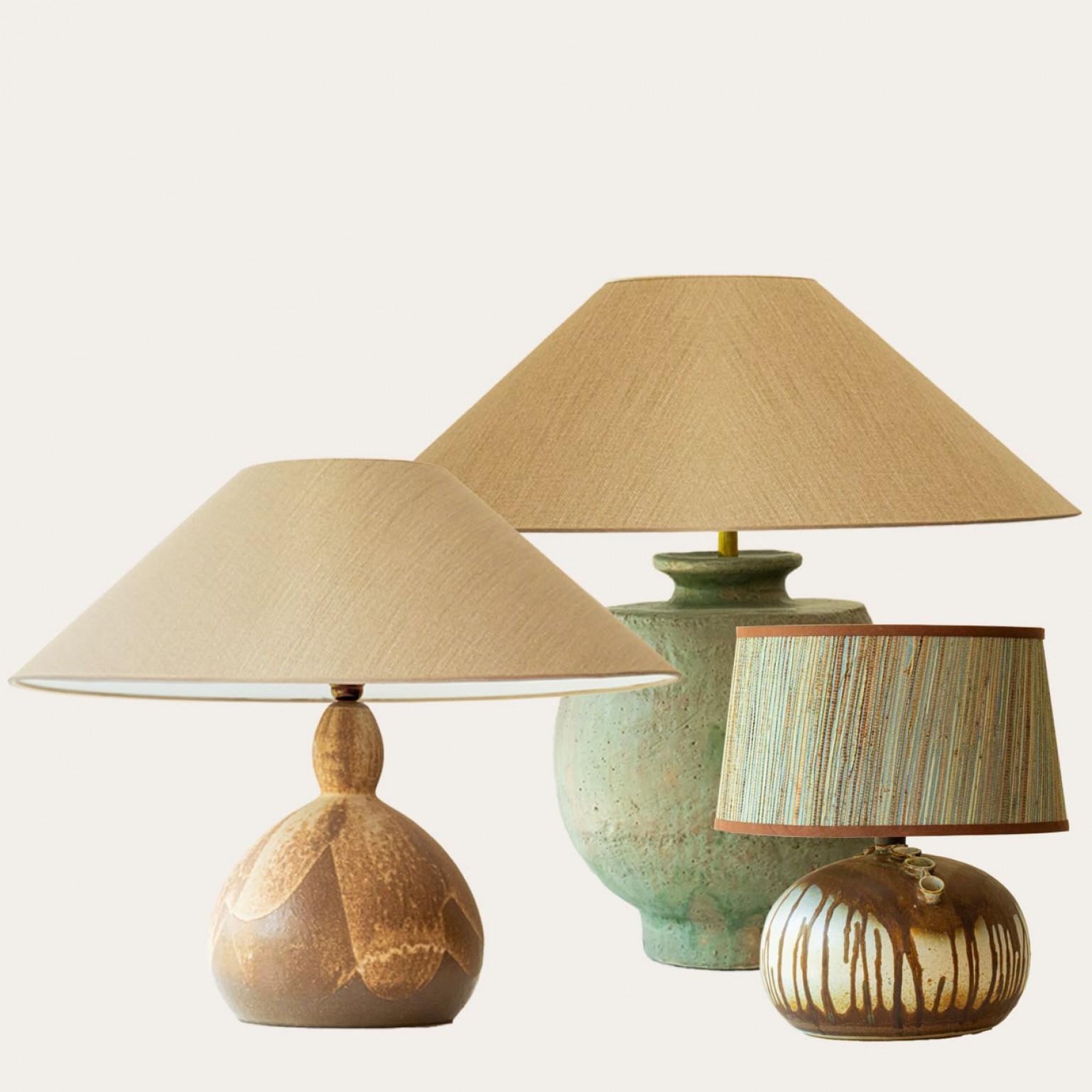 One of the three ceramic table lamps, 1970s.

This set brings a rich visual appeal to any interior. With its beautiful shapes, it offers a unique presence.

The bases with brown and green shades fit perfectly with the custom made lamp shades, with
