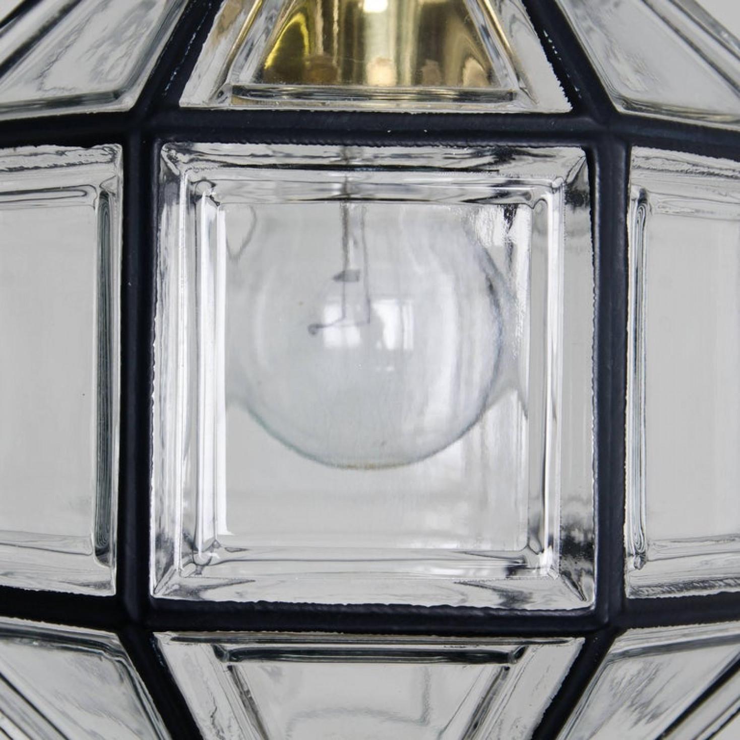 This octagonal glass pendant lights were manufactured by Glashütte Limburg in Germany during the 1960s. Beautiful craftsmanship.

The lamp, made from elaborate clear glass features one E27 socket and brass suspension.

Heavy quality and in perfect