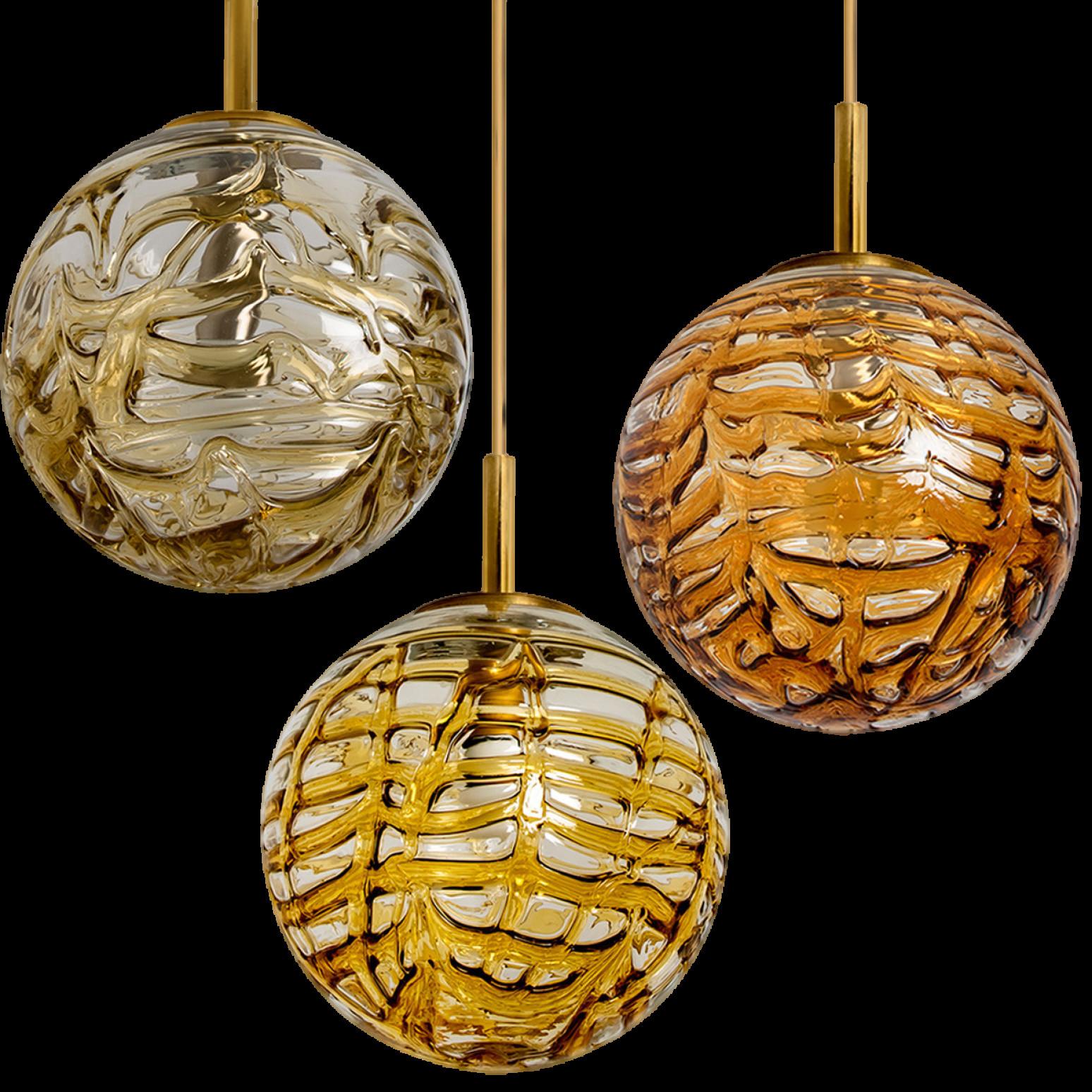 1 of the 3 Doria Leuchten globes (in collaboration with Murano) in the style of Venini, manufactured, circa 1960. Real statement piece.

High-end thick Murano crystal glass shades made out of overlay glasses in the colors Taupe, Yellow and Orange,