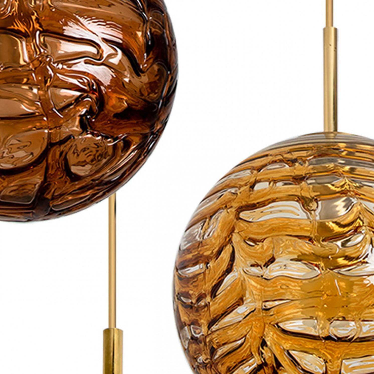 1 of the 3 Doria Leuchten globes (in collaboration with Murano) in the style of Venini, manufactured, circa 1960. Real statement piece.

High-end thick Murano crystal glass shades made out of overlay glasses in the color yellow, orange and brown,