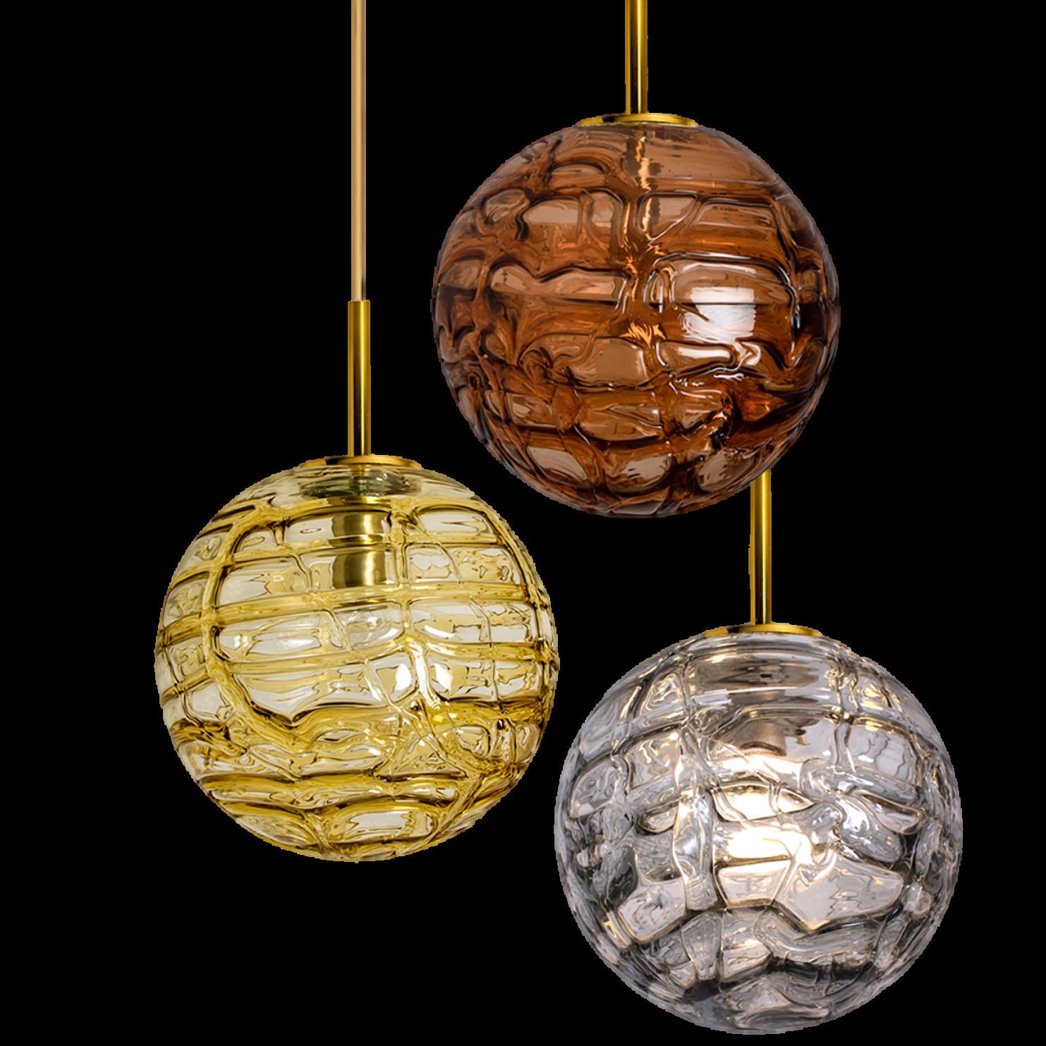 1 of the 3 Doria Leuchten globes (in collaboration with Murano) in the style of Venini, manufactured, circa 1960. Real statement piece.

High-end thick Murano crystal glass shades made out of overlay glasses in the color warm honey/amber yellow