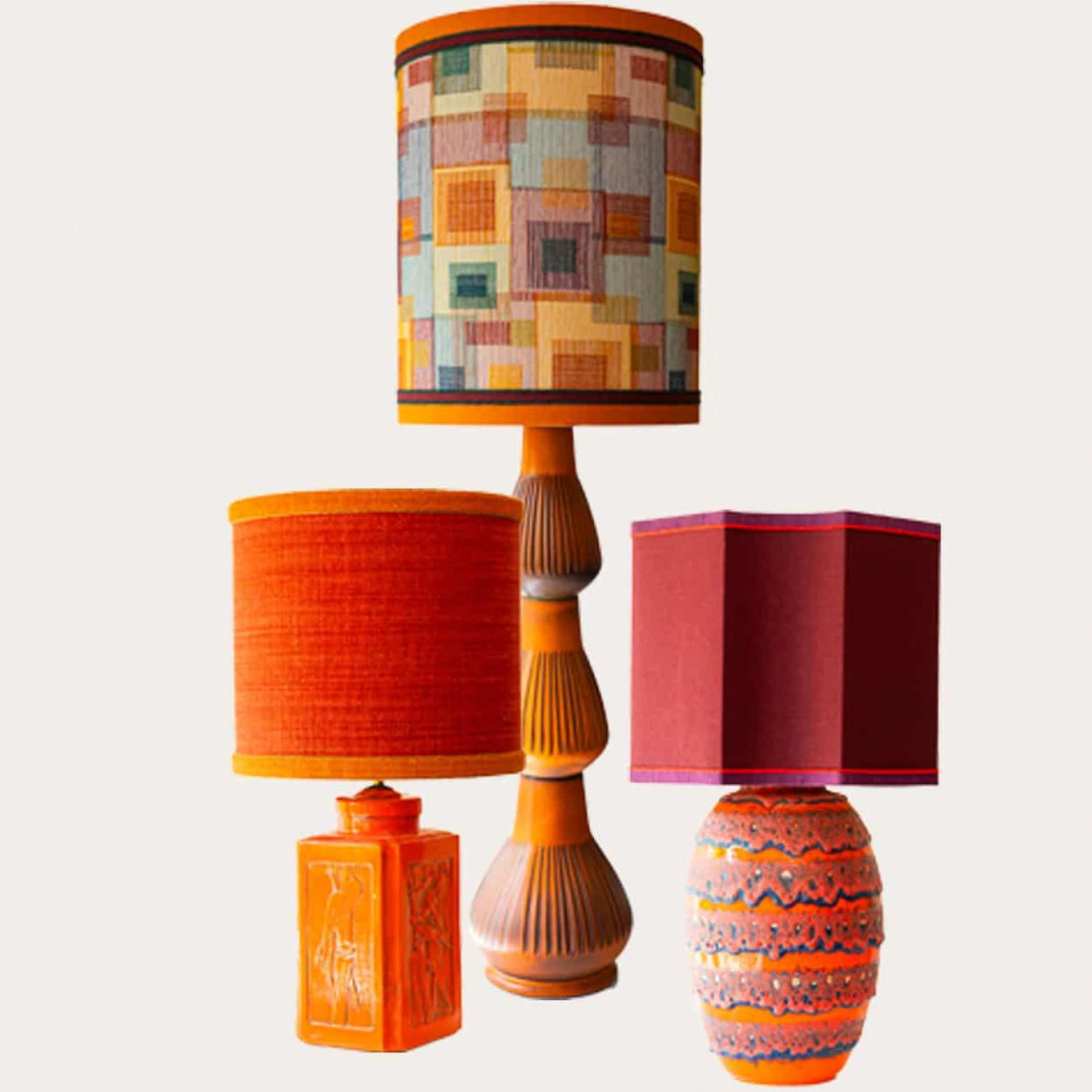 One of the six orange and red floor and table lamps, 1970s.

This set brings a rich visual appeal to any interior. With its beautiful shapes, it offers a unique presence.

The bases with warm, ochre, brown and orange tones and different materials