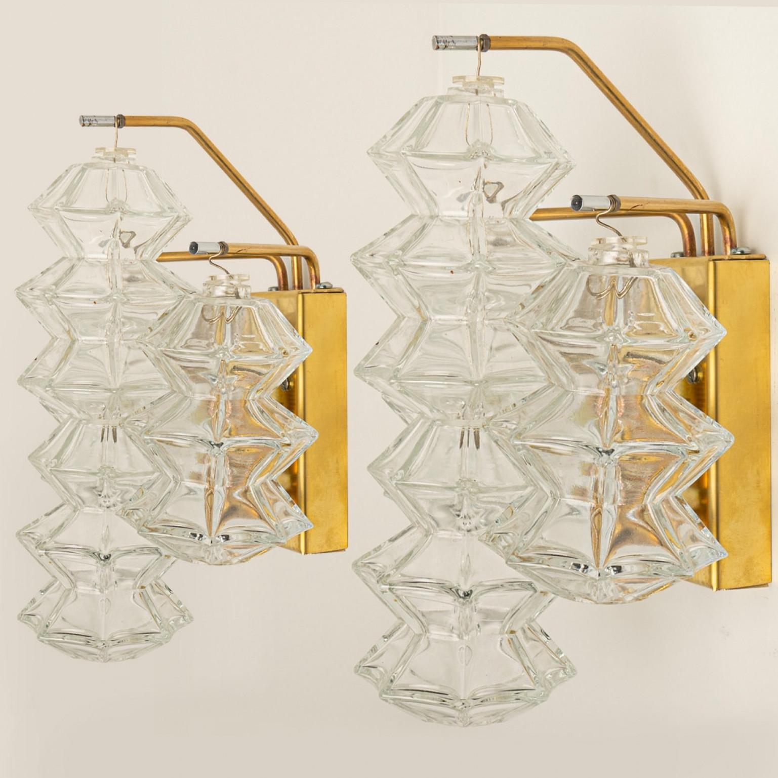 Mid Century Modern vintage glass brass pair of Pagoda sconces by Kalmar, circa 1969, Austria Vienna.

Each sconce shows ten exceptional pagoda shaped glasses mounted on a brass frame.

In excellent vintage condition both glass and brass frame,
