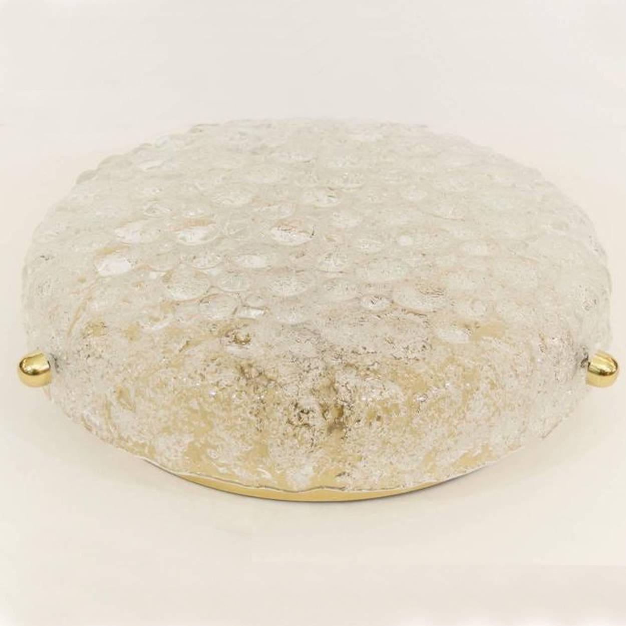 three  high quality modern textured ice glass flush mounts by Hillebrand, circa 1965.
This flush mounts are featuring a huge round glass dish.

The dish is handmade of 'Frit' glass.

Many of tiny glass herds which are molded into the glass during