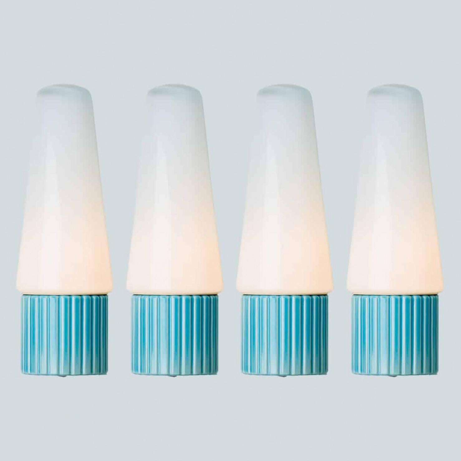 1 of the 4 stunning wall lights, made by Sigvard Bernadotte around the 60s. The lights are made of a white cone-like glass cups, held up by an aqua ceramic handle, creating a classy and stylish effect.



'Design Prince' Sigvard Bernadotte was a