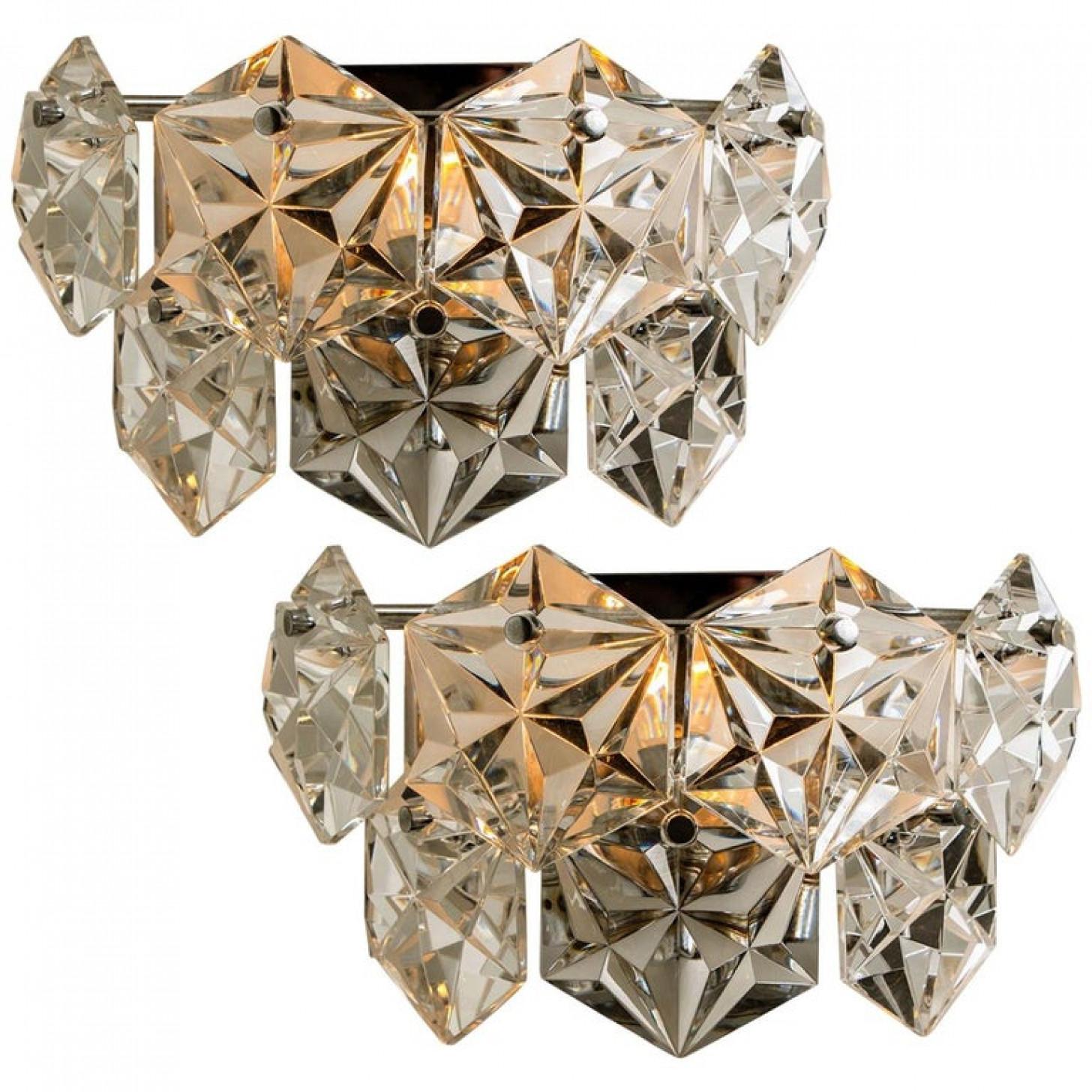 1 of the 4 luxurious of chrome frames and thick diamond crystal sconces by the famed maker, Kinkeldey. Very elegant light fixtures, comfortable with all decor periods. The crystals are meticulously cut in such a way that radiate the light of the