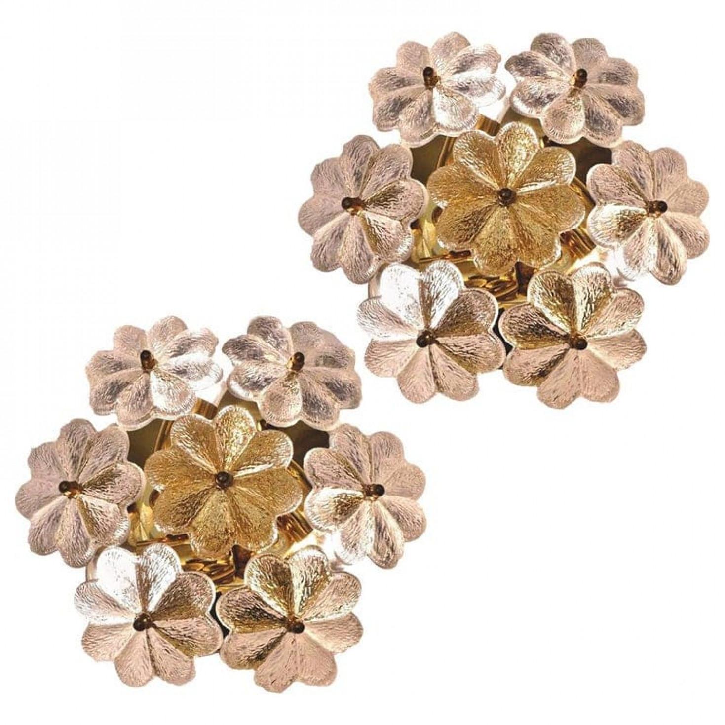 These sculptural wall sconces have the design of a bouquet of textured glass flowers and are from the historical lighting company Ernst Palme. Each light has seven glass shades.

Each clear glass flower shade has textured petals and is securely