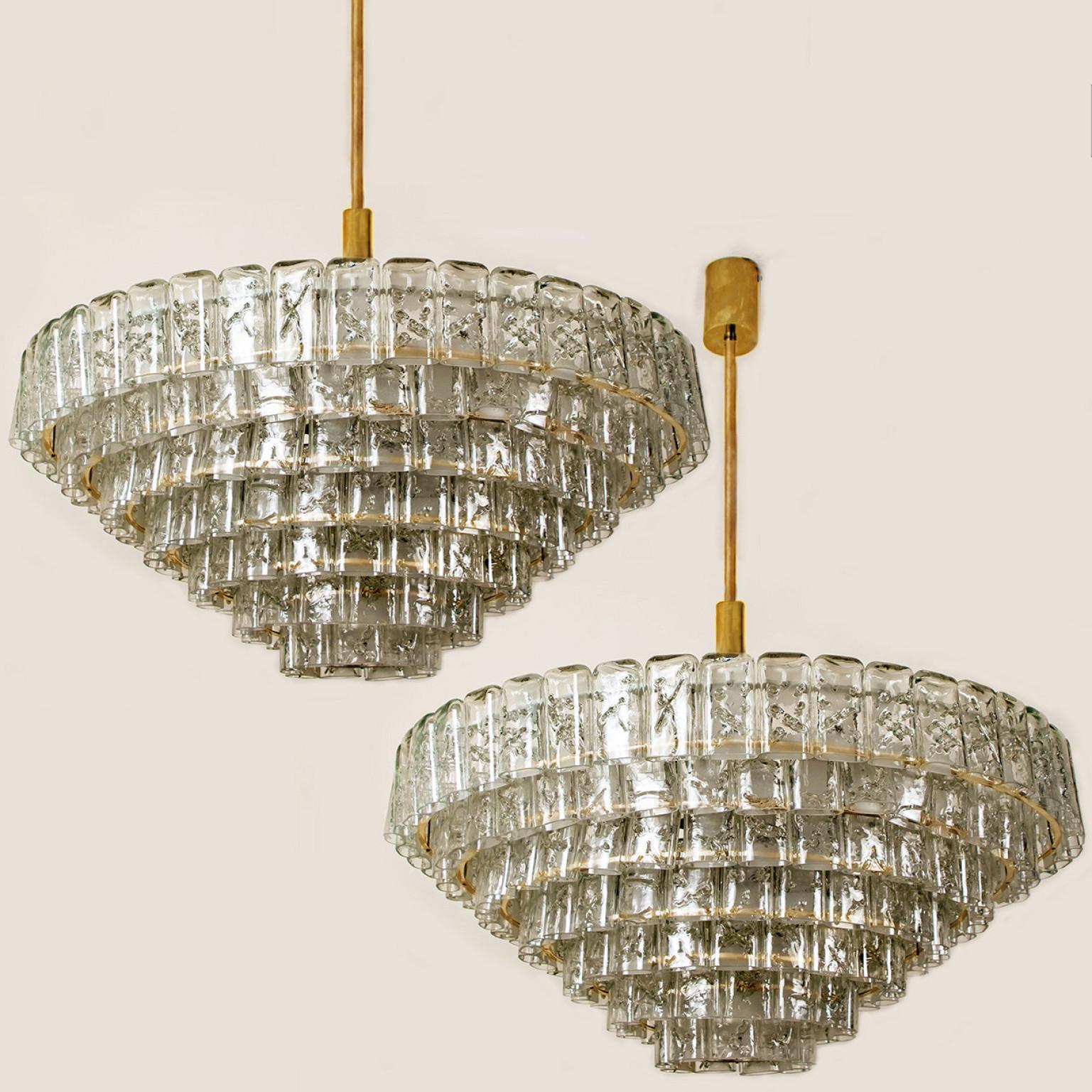 We ofer a amazing high-end light fixture. The pair is executed to a high standard. Beautiful craftsmanship. The light fixture not only functions as light source but also as a sculptural component.

The stylish and clean elegance of this chandelier