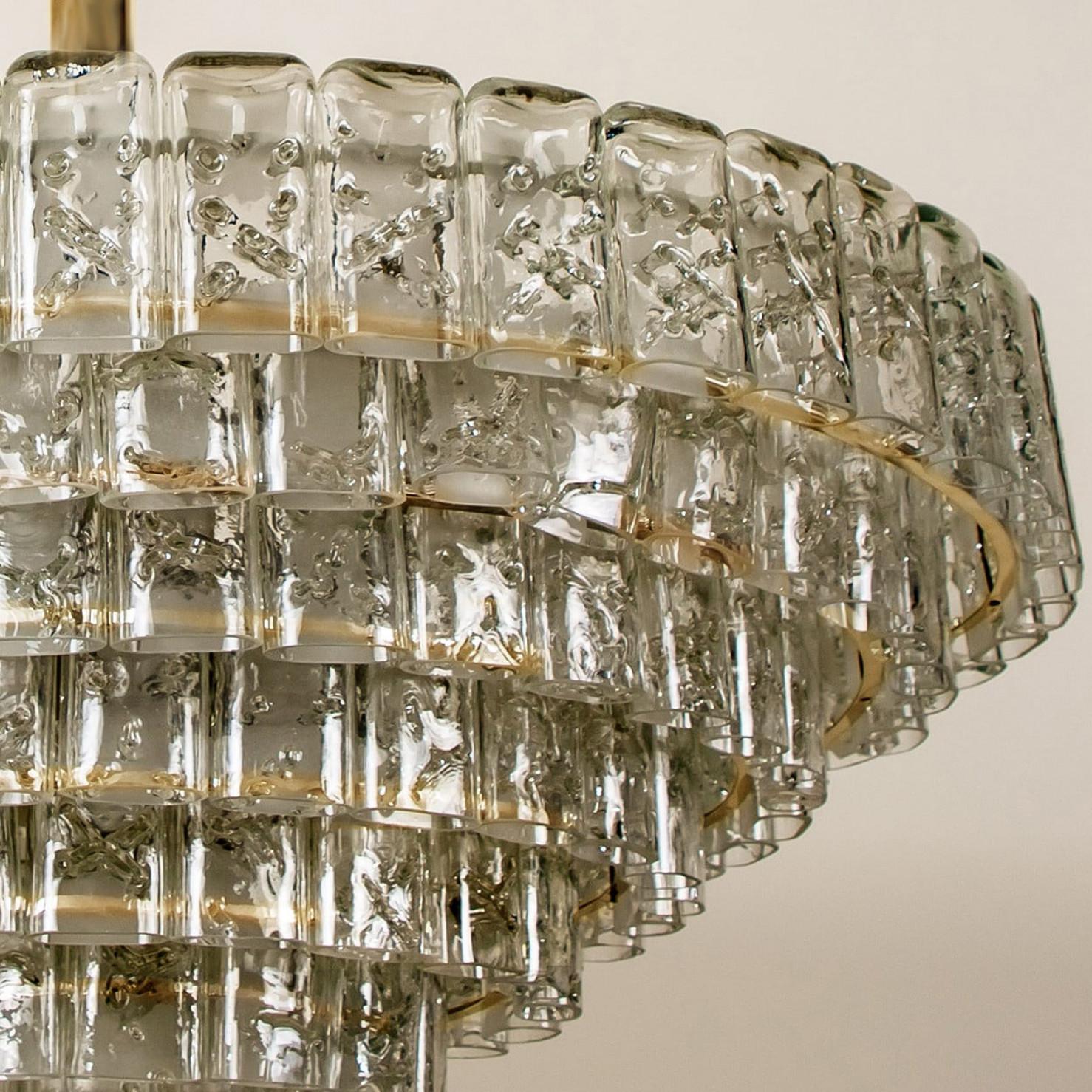 We ofer a amazing high-end light fixture. The pair is executed to a high standard. Beautiful craftsmanship. The light fixture not only functions as light source but also as a sculptural component.

The stylish and clean elegance of this chandelier