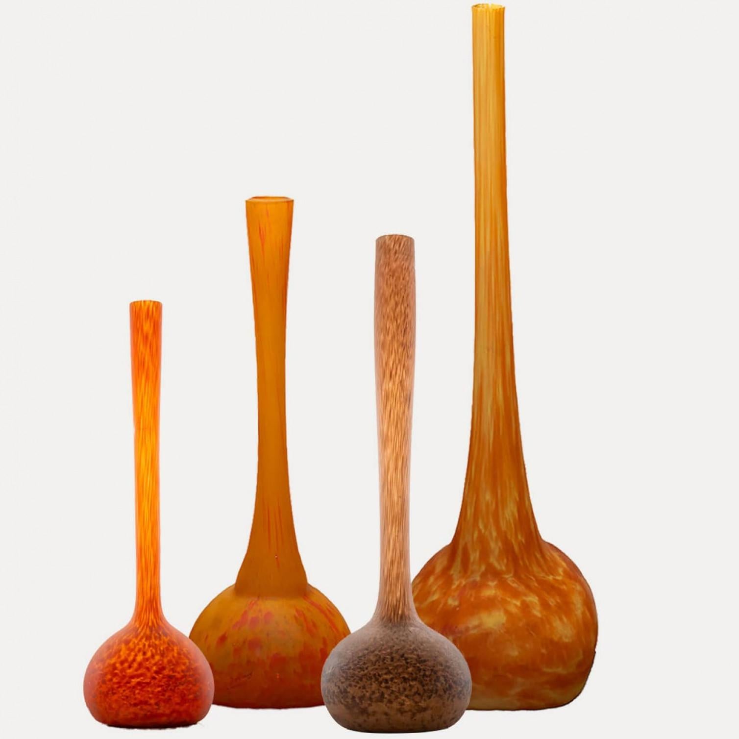 Luxury at its finest, high-end glass vases with orange and amber colors by Daum, France.

The vases - pâte de verre - have different warm amber and orange tones. Beautiful glass.

Please notice the price is for one piece, we have four different