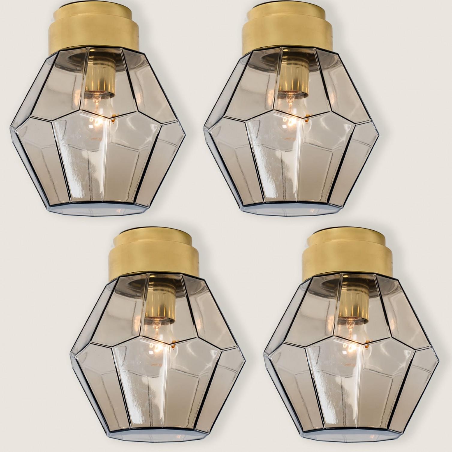 1 of the 4 beautiful smoked glass flush mounts from Glashütte Limburg, 1970s.

The circular metal frame holds the hand blown light smoked glass. Illuminates beautifully.

Good quality and in perfect condition. Cleaned, re-wired and ready to